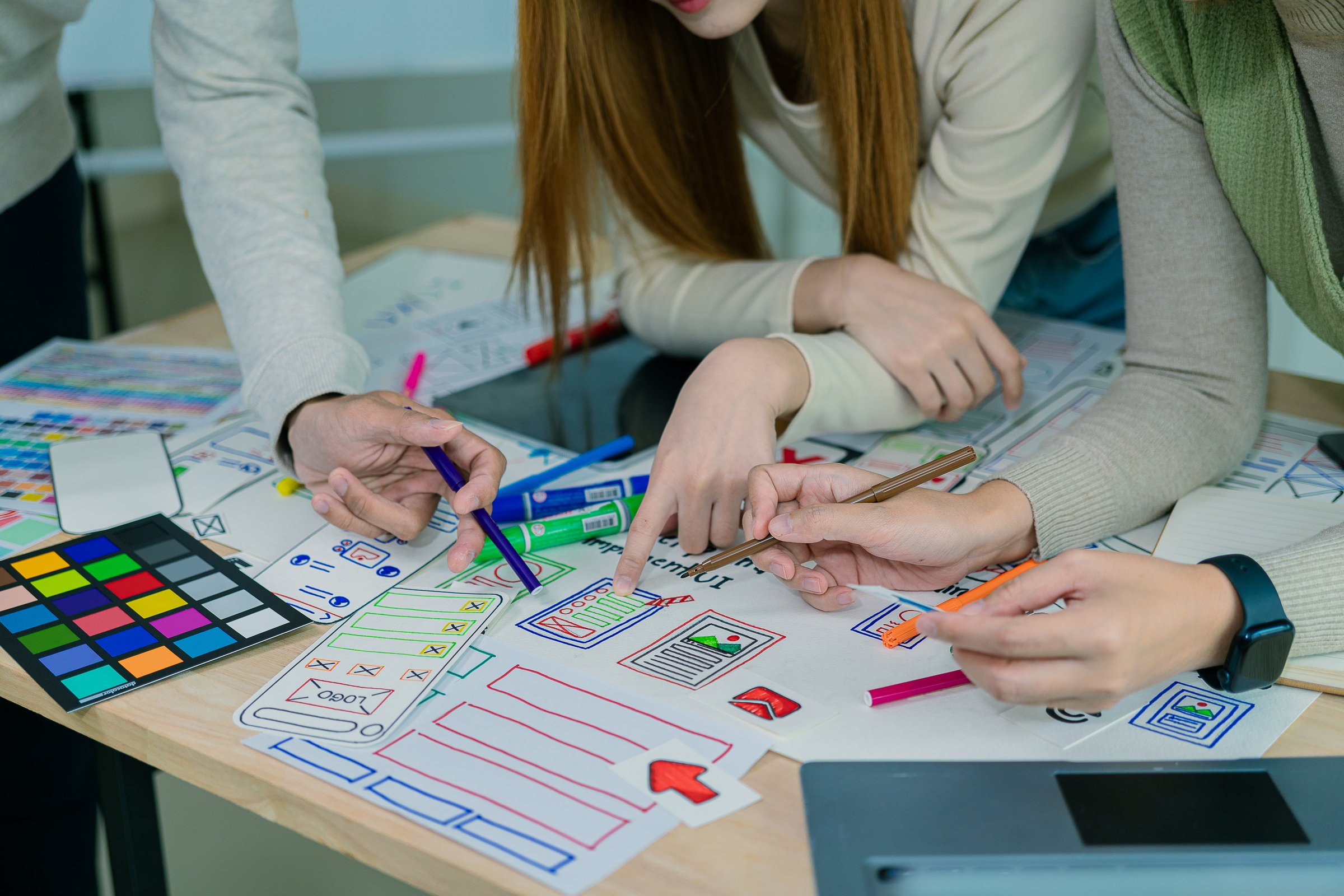 Application development UI UX web designer team is working together to develop a mobile responsive website with UI UX front end designer examples,