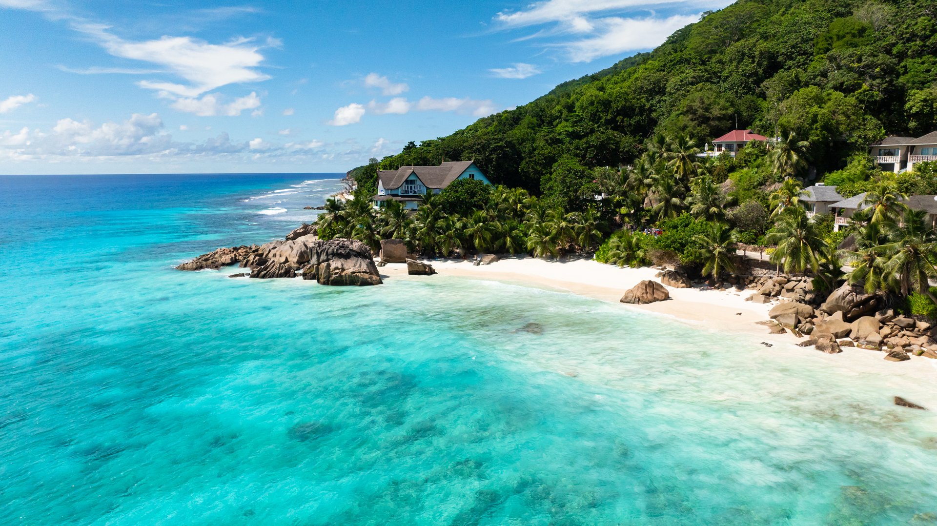 Seascape with tropical sandy beach and blue ocean. Seychelles, La Digue. Anse Patates.