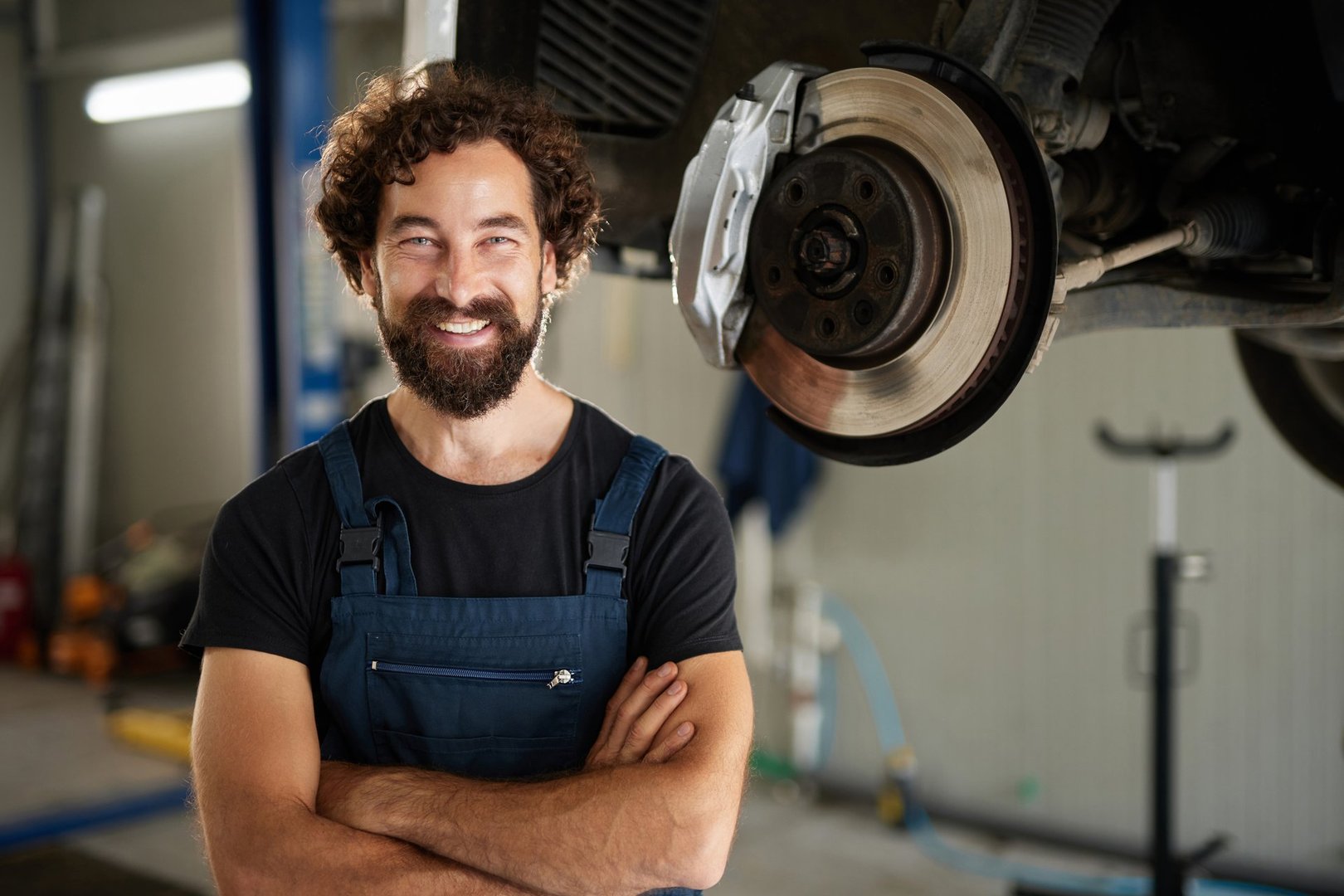 Confident mechanic smiling at camera