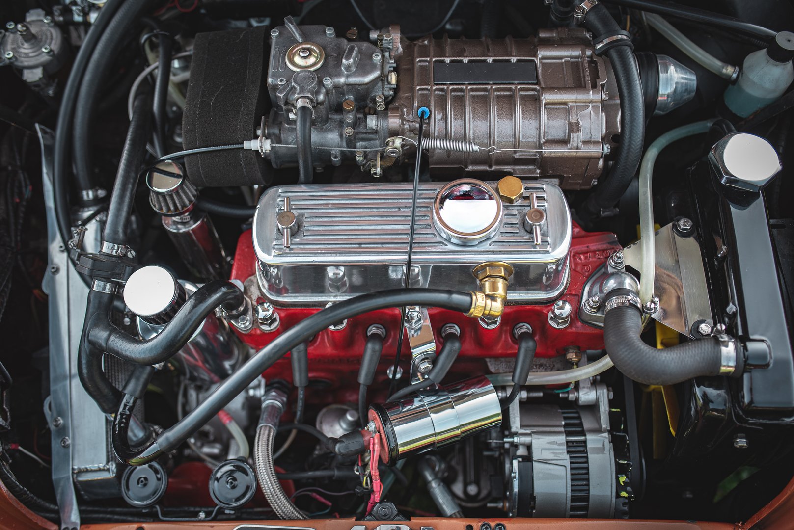 Small supercharged engine of a classic British car on a vintage car show