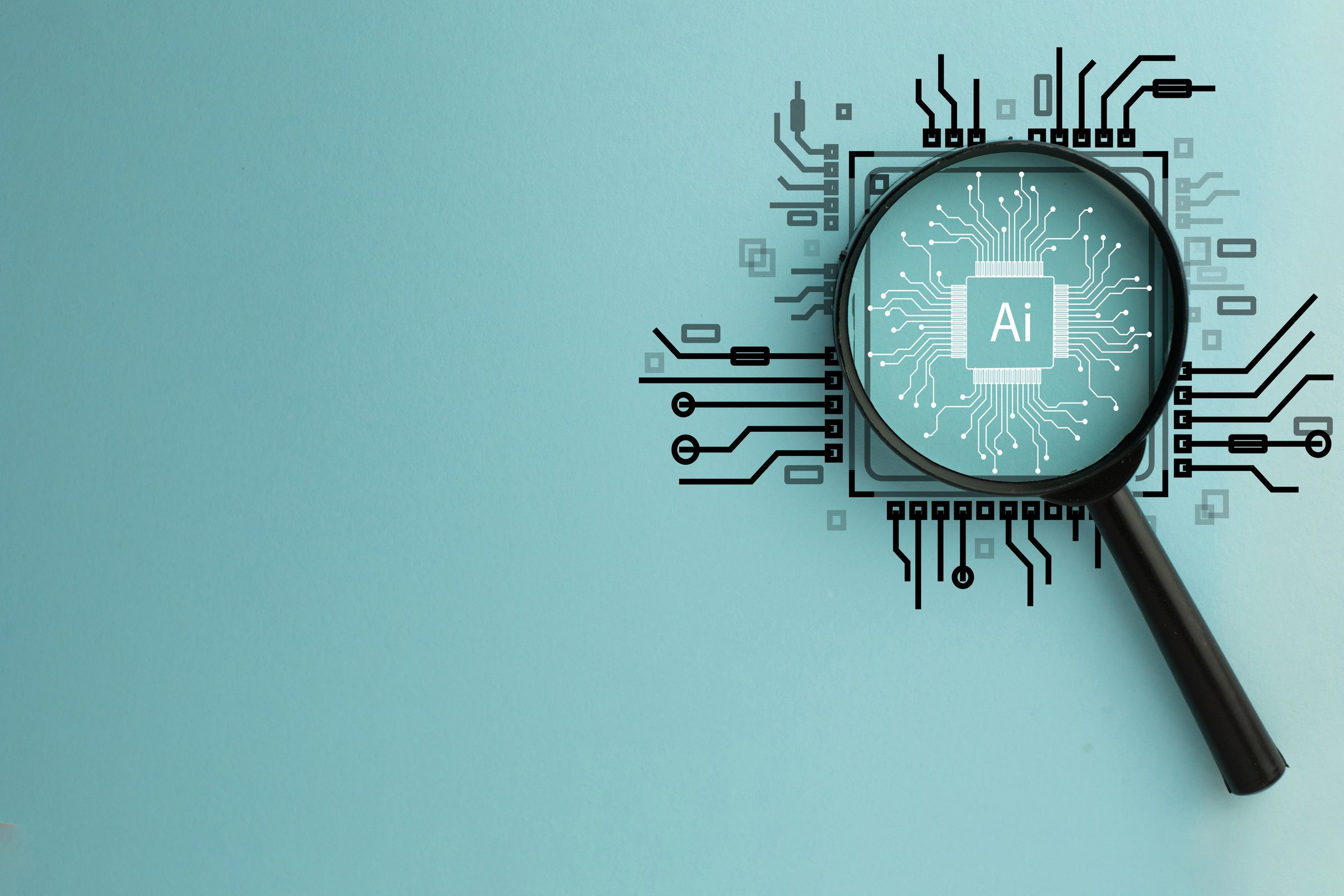 Magnifying Glass Focused on Circuit Board with AI Word, Representing Artificial Intelligence and Technology Innovation.