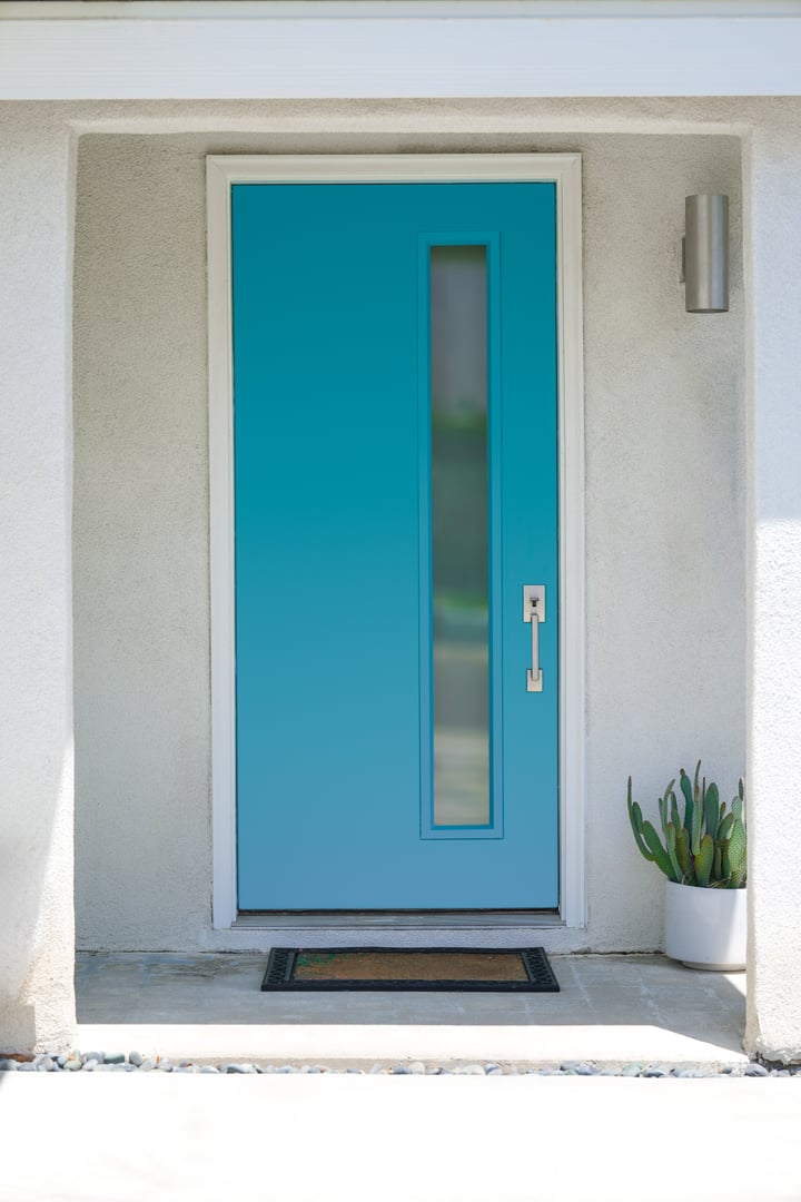 Bright blue mid-century modern front door in Palm Springs California