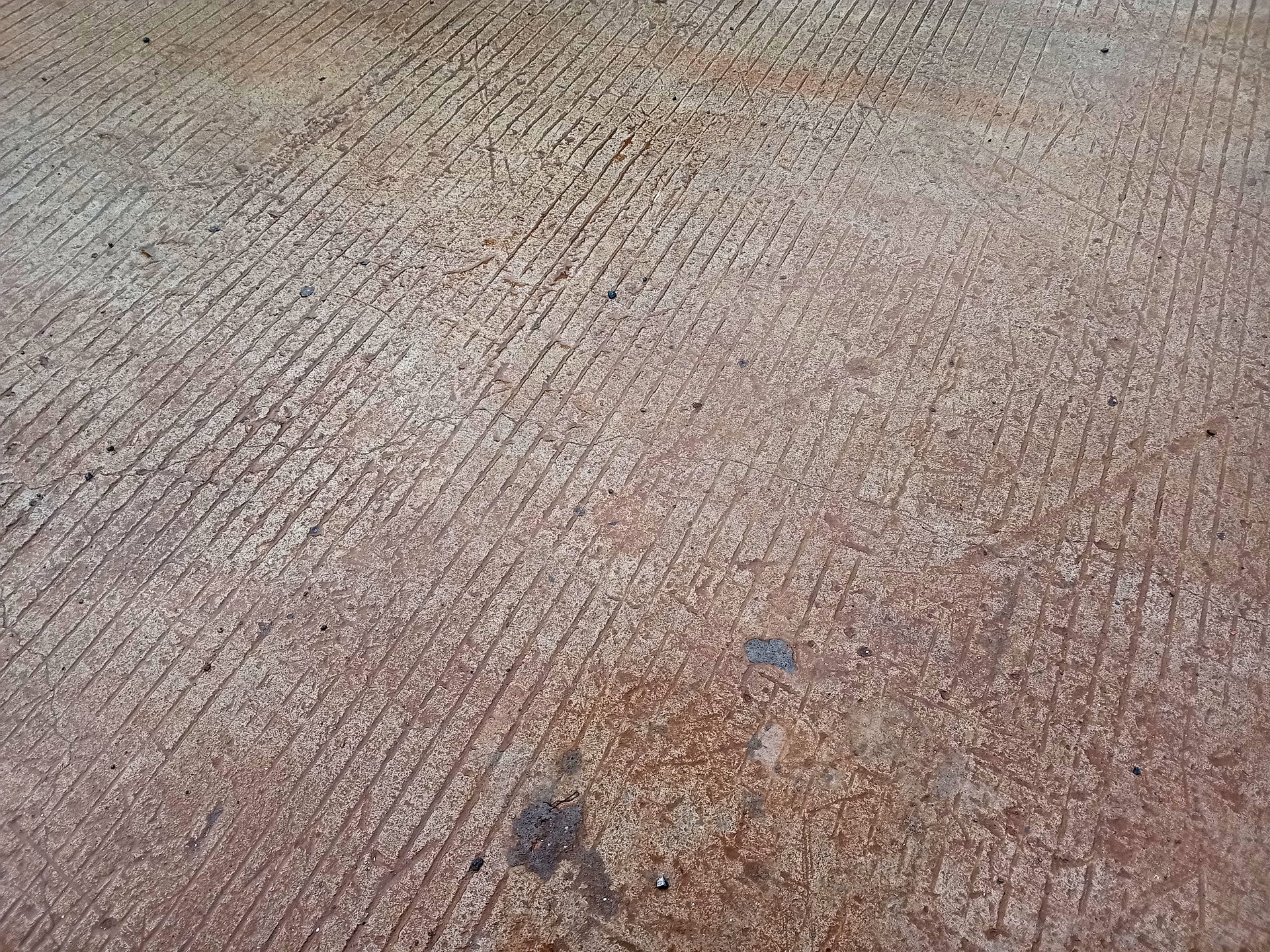 Red clay staining on concrete driveway in Wake Forest NC