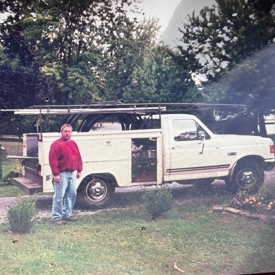 Griffen Pump Service technician standing by service truck in Hudson Valley NY