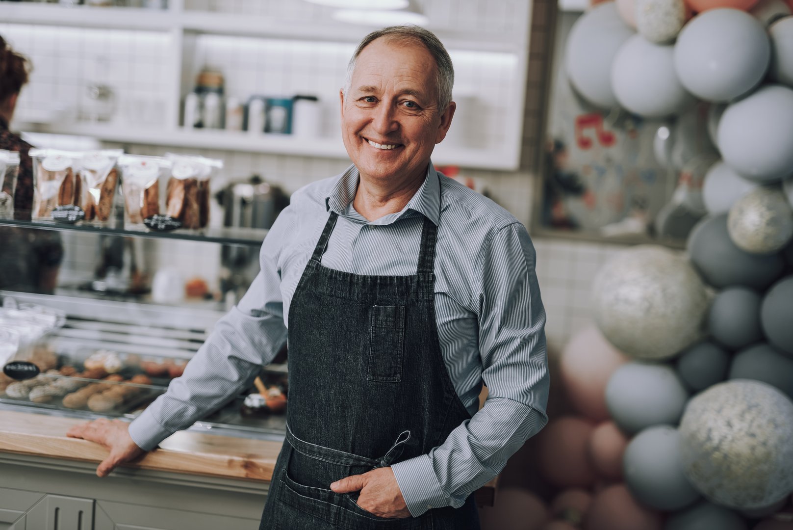 Smiling Male Business Owner Leaning