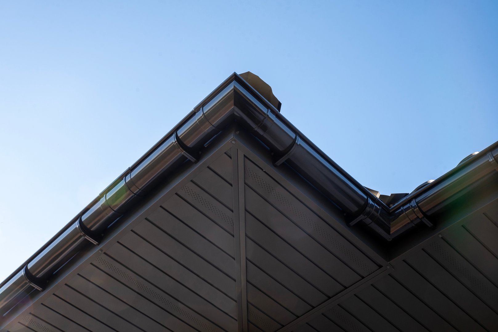 Plastic gutters for the roof of a house background