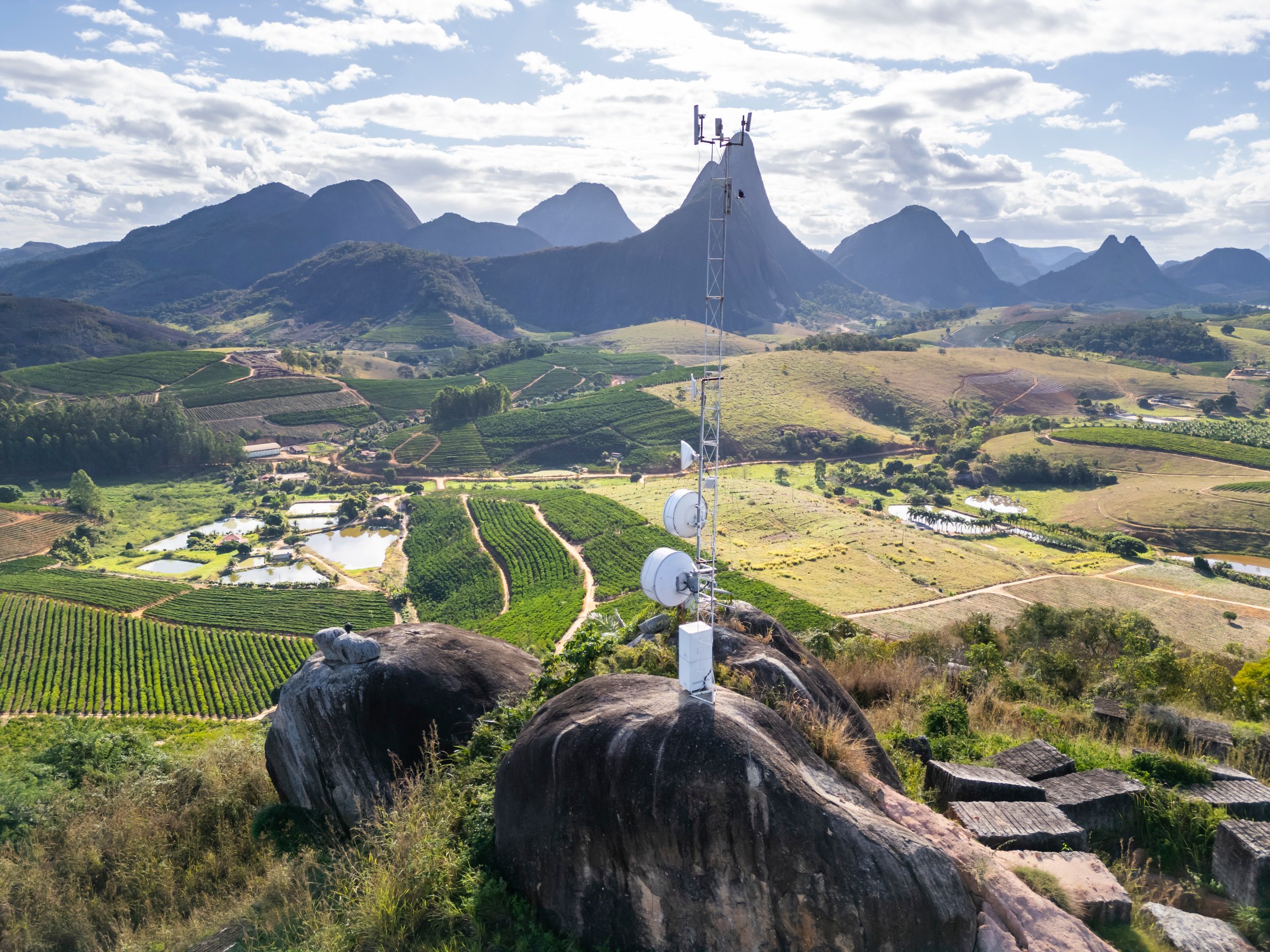 Aerial drone view of a telecommunication tower providing vital communication services to the rural area of Aguia Branca, Espirito Santo, Brazil