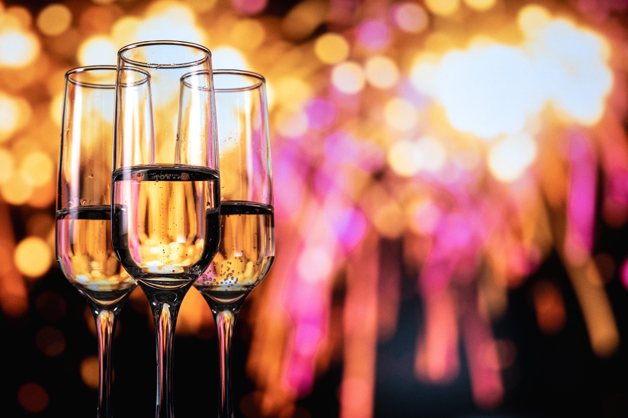Champagne celebration scene, Celebratory toast at wedding reception with glowing bubbly
