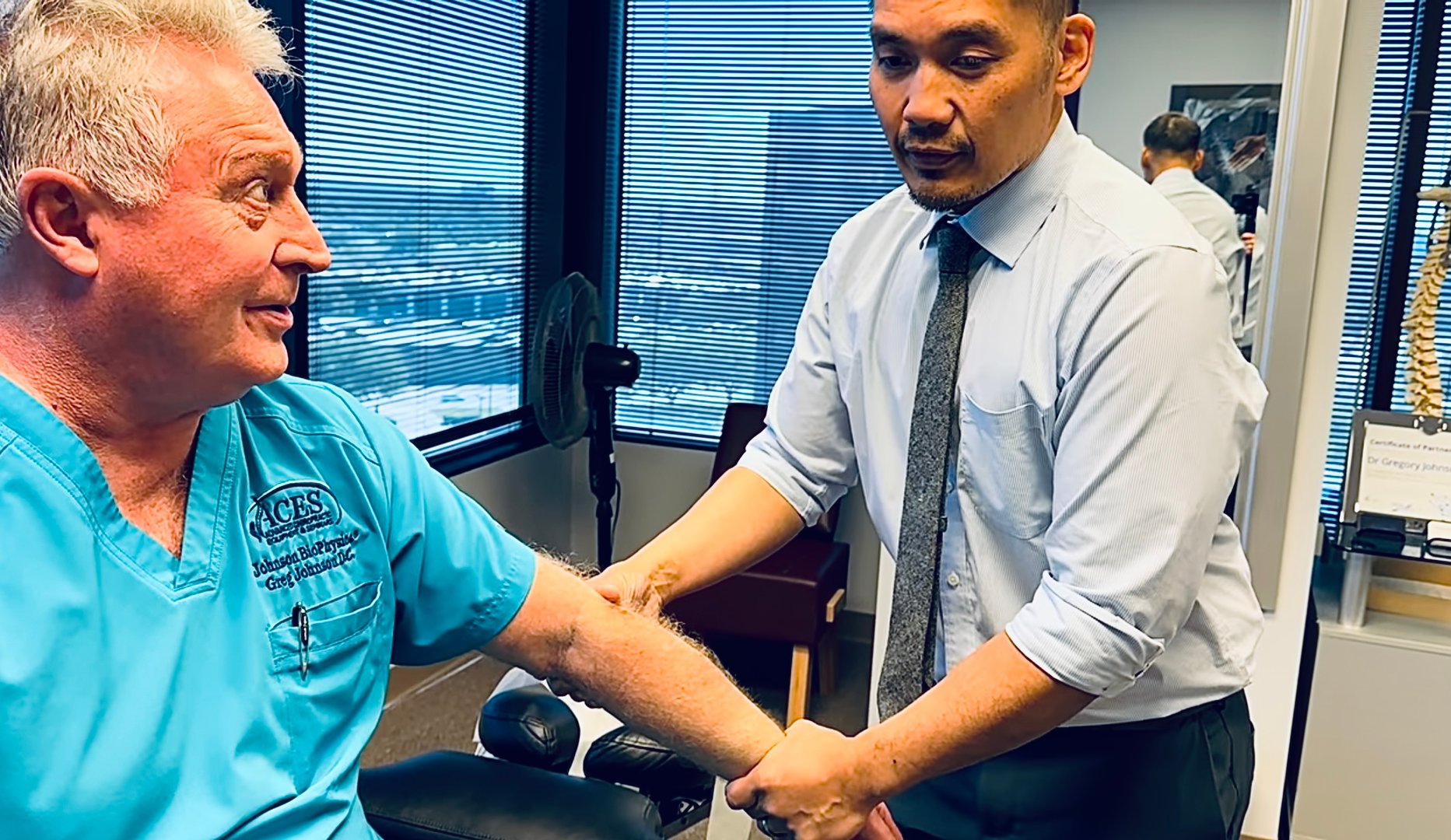 Dr. Bantique with patient at Bantique Chiropractic