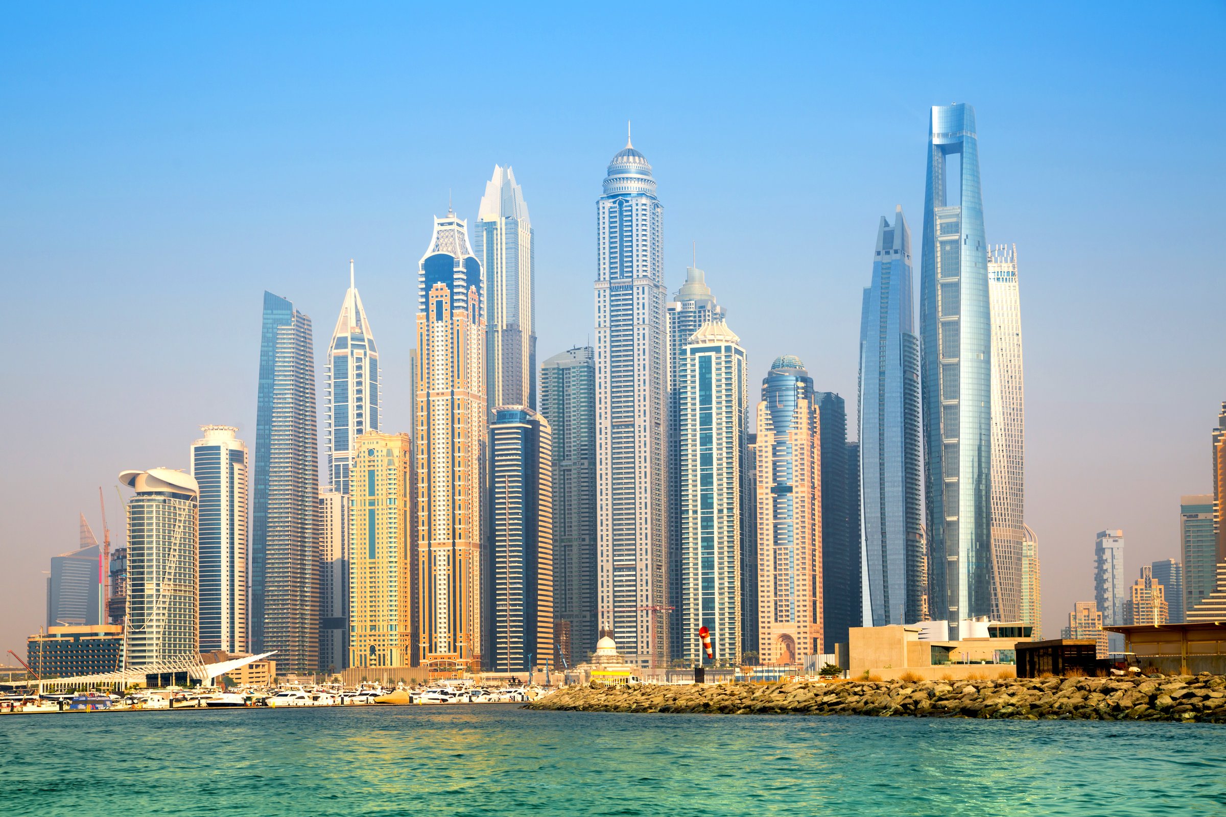 Dubai Marina skyscrapers view at sunset. Panoramic view from boat