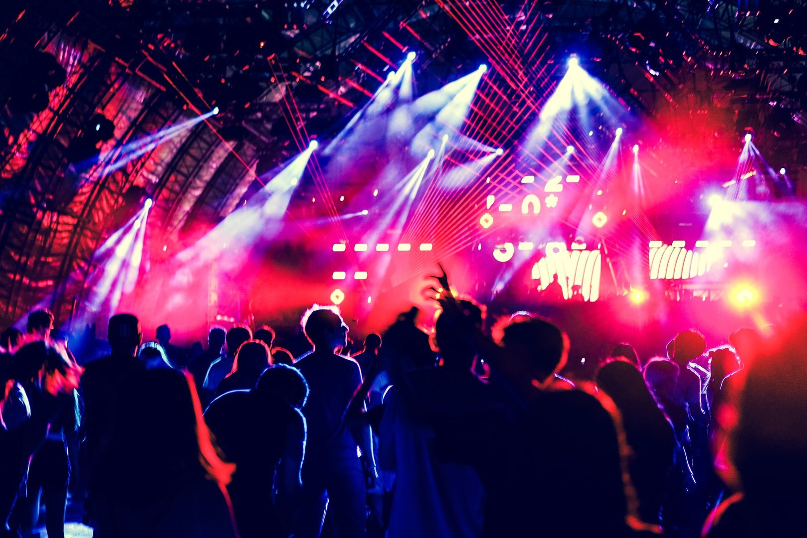 Defocused entertainment concert lighting on stage, blurred disco party and Concert Live.