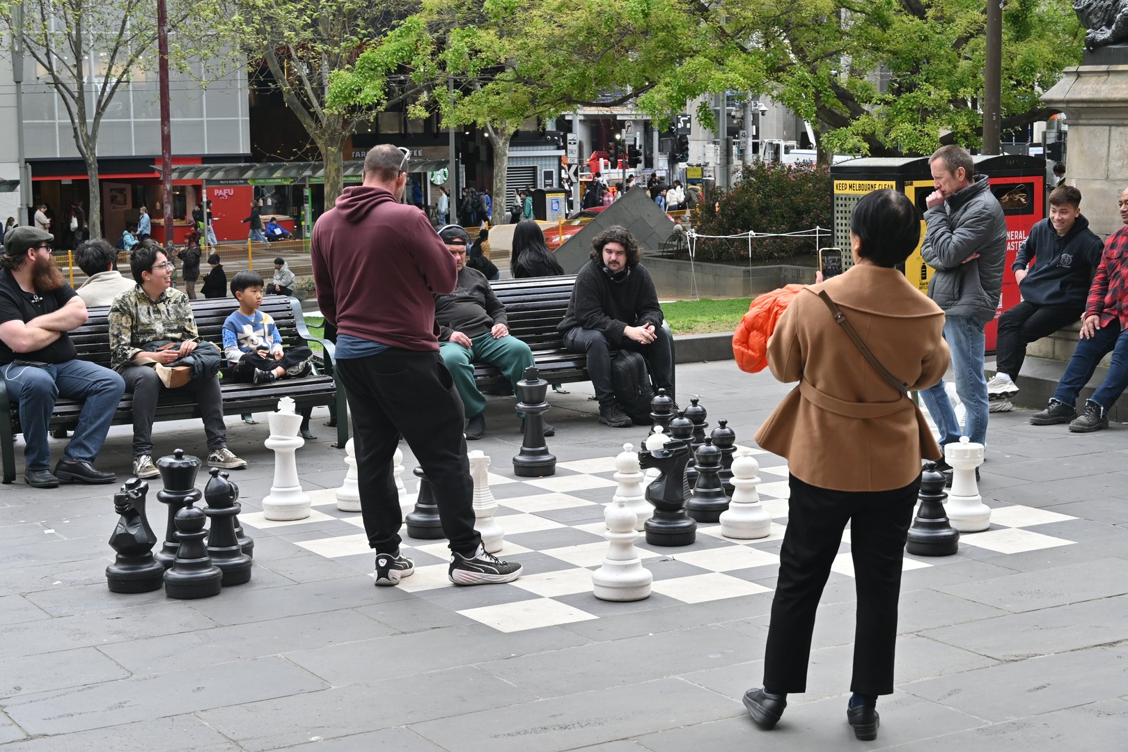Melbourne, Australia - September 13, 2024 - People playing chess on the street outside State Library Victoria, Australia's oldest public library