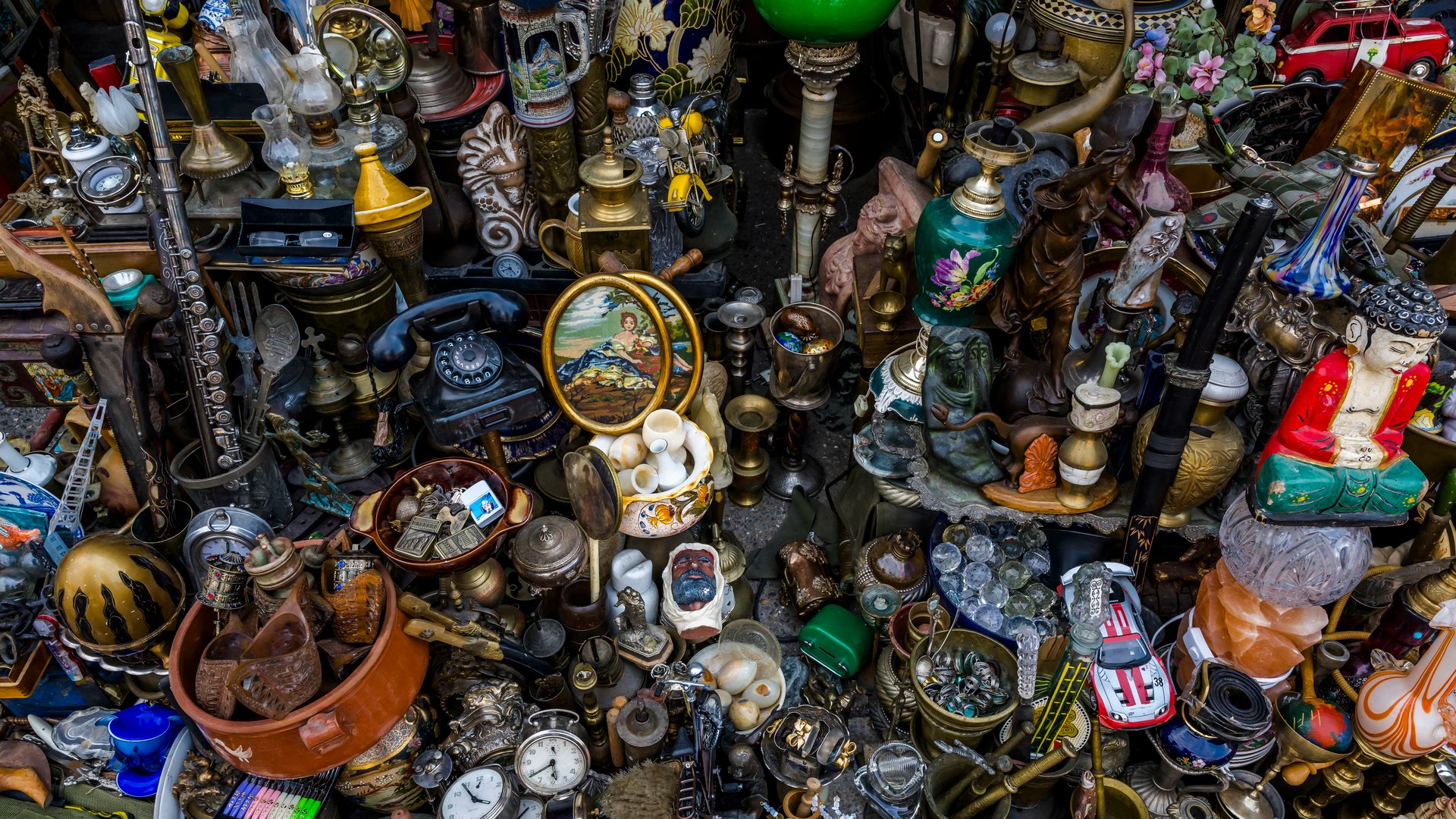 A vibrant assortment of vintage and antique items, showcasing trinkets, statues, and collectibles for eclectic decorating or historical appreciation.