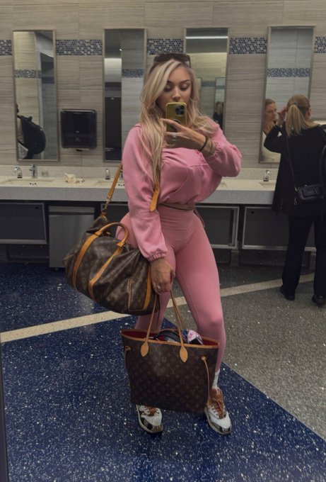 Legal luxury courtesan Nico Bradley relaxing in a high-end room at the Moonlite BunnyRanch, a licensed legal brothel in Nevada offering upscale companionship.