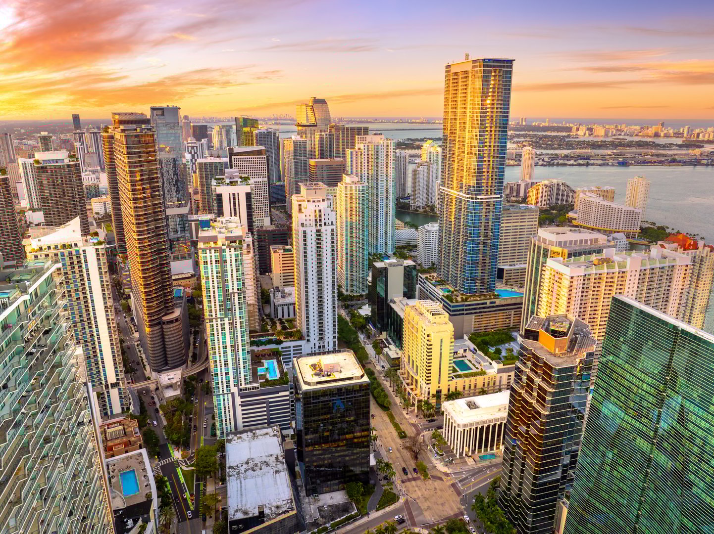 Miami Brickell in Florida, USA at sunset. View from above of skyscraper buildings in downtown district. American megapolis with business financial district.