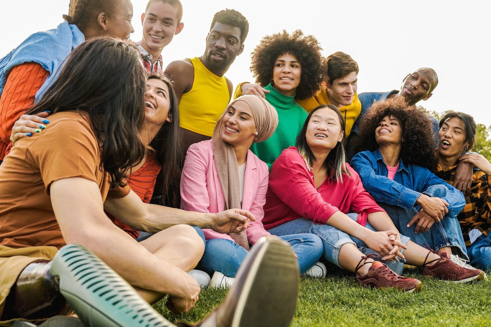 Diverse friends having fun outdoor during summer vacations - Focus on muslim girl face - Diversity and multiethnic community concept