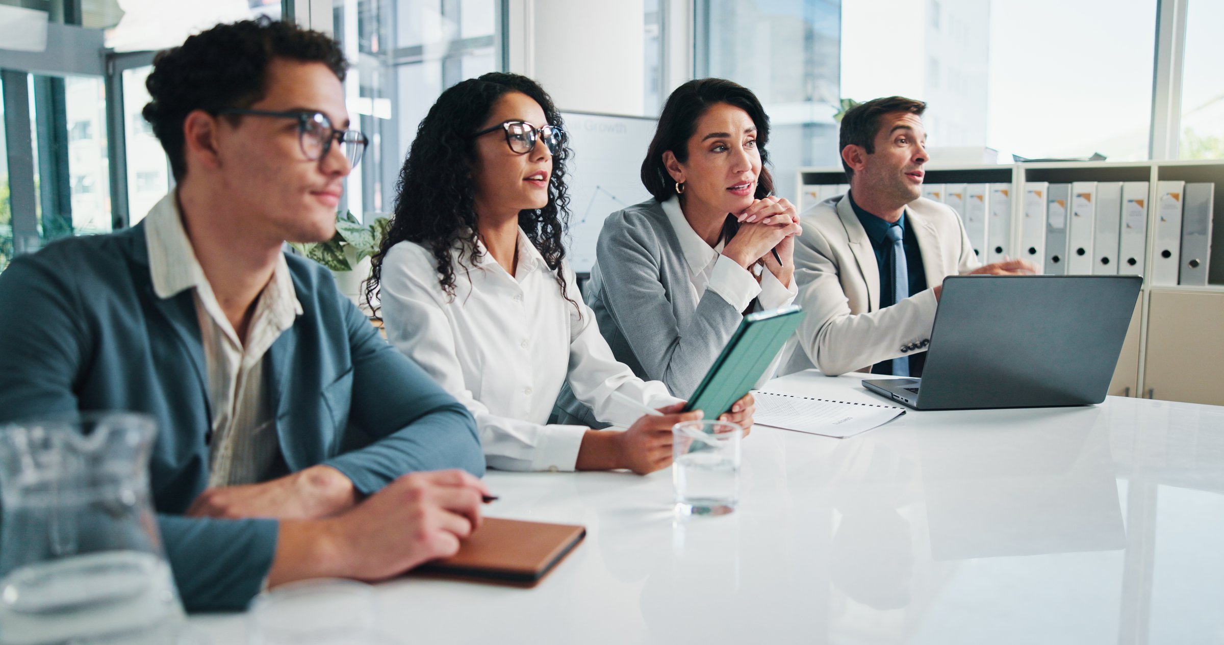 Meeting, listen or business people with shareholders in presentation for planning or capital growth. Manager, contract negotiation or financial advisors in meeting with executive directors in office