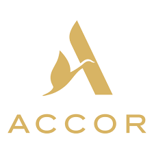 Golden logo of Accor with stylized bird design and company name below.