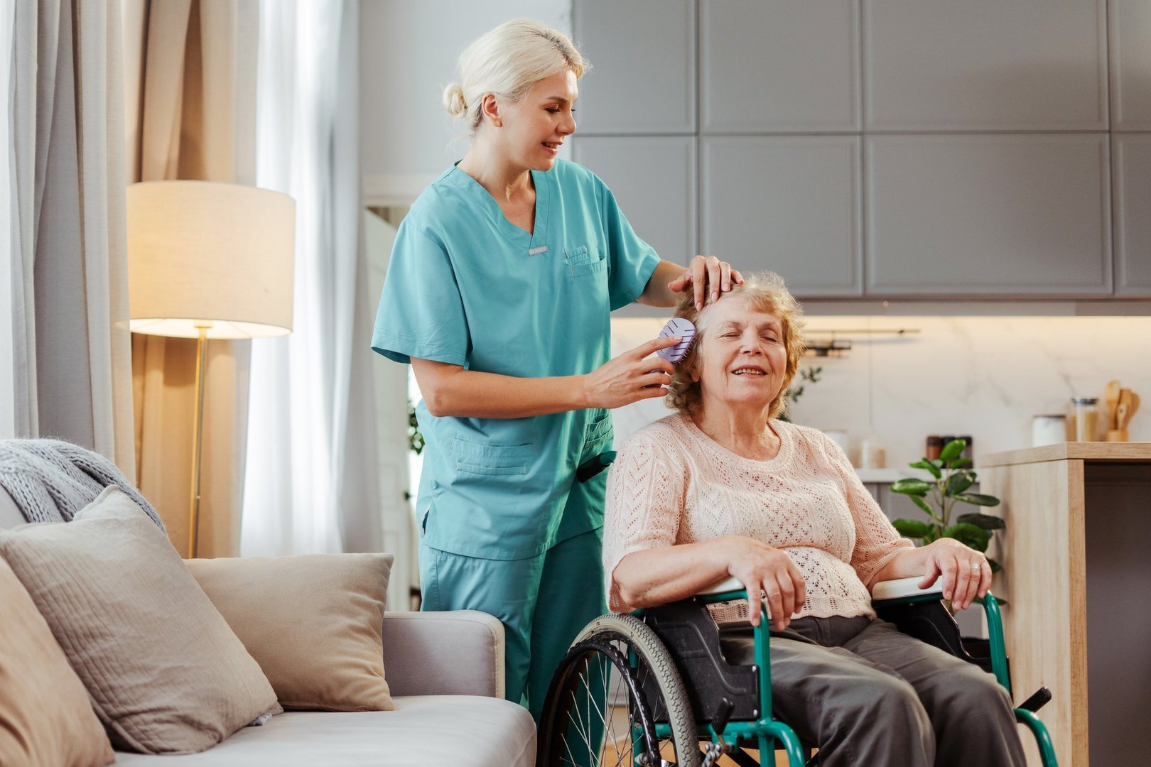 Nurse caring for senior woman at home