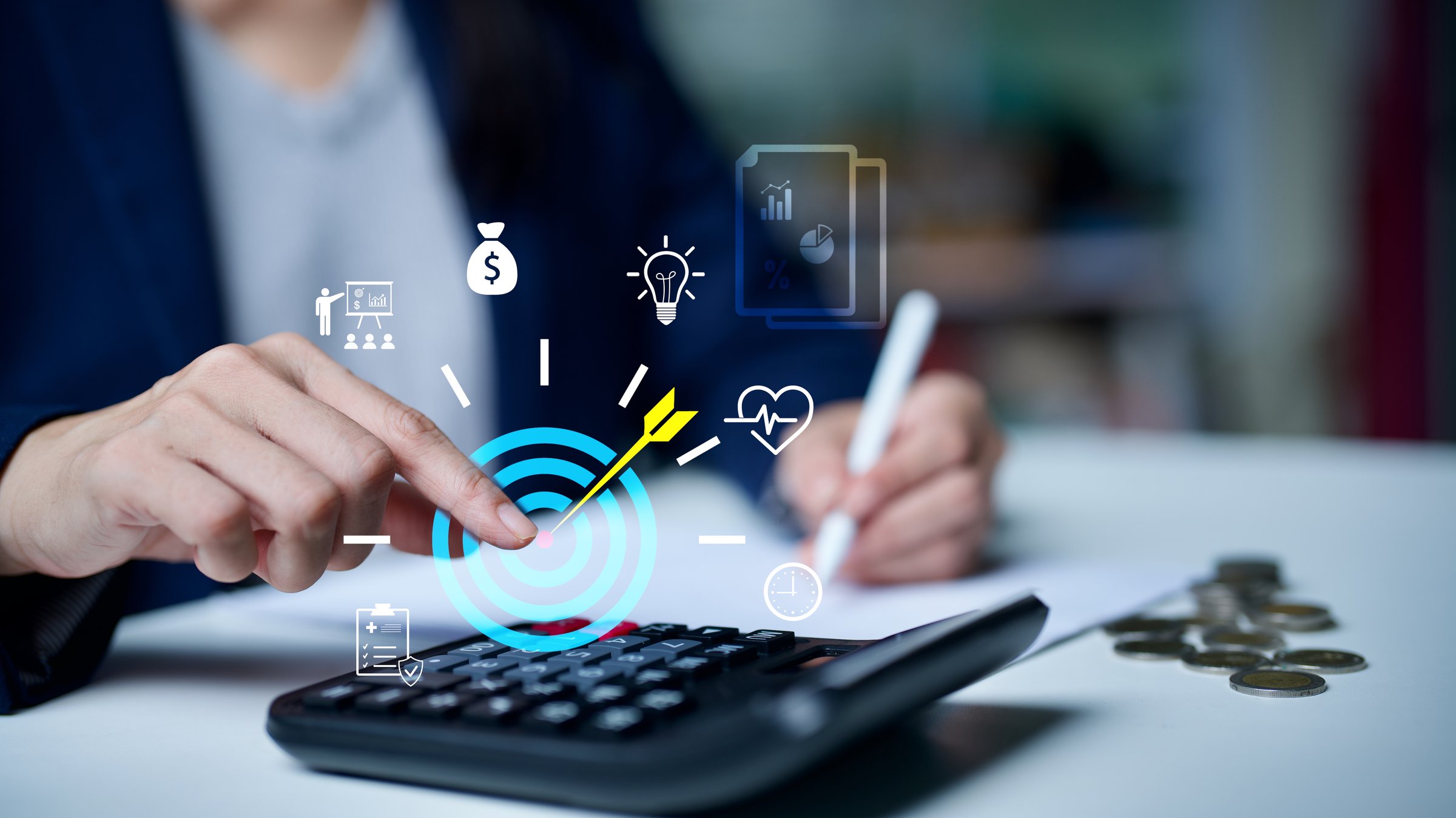 Business professional calculating finances on calculator with digital target icon, symbolizing financial planning, budget control, investment strategy, goal achievement and smart money management