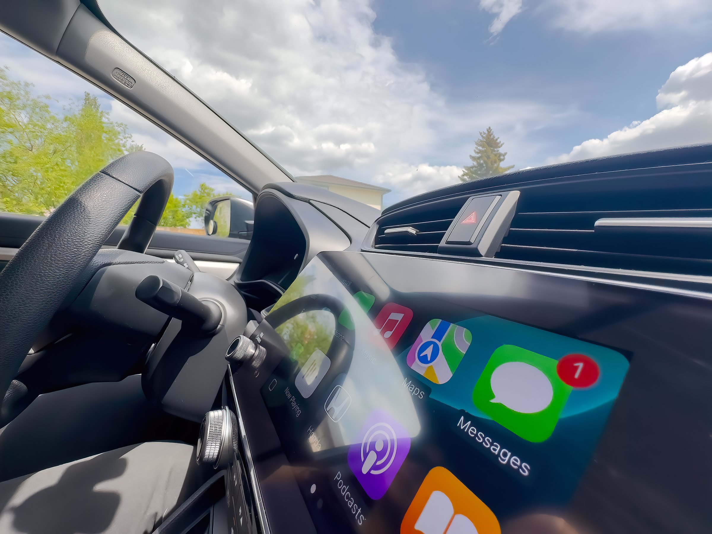Calgary, Alberta, Canada. Jun 8, 2025. A dynamic in-car shot showcases a modern infotainment system with Apple CarPlay, highlighting seamless tech integration for the connected driver.