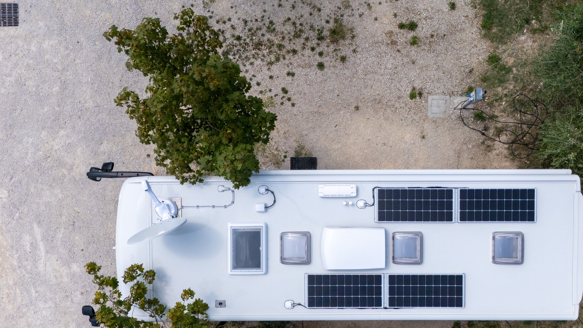 RV roof with solar panels and satellite