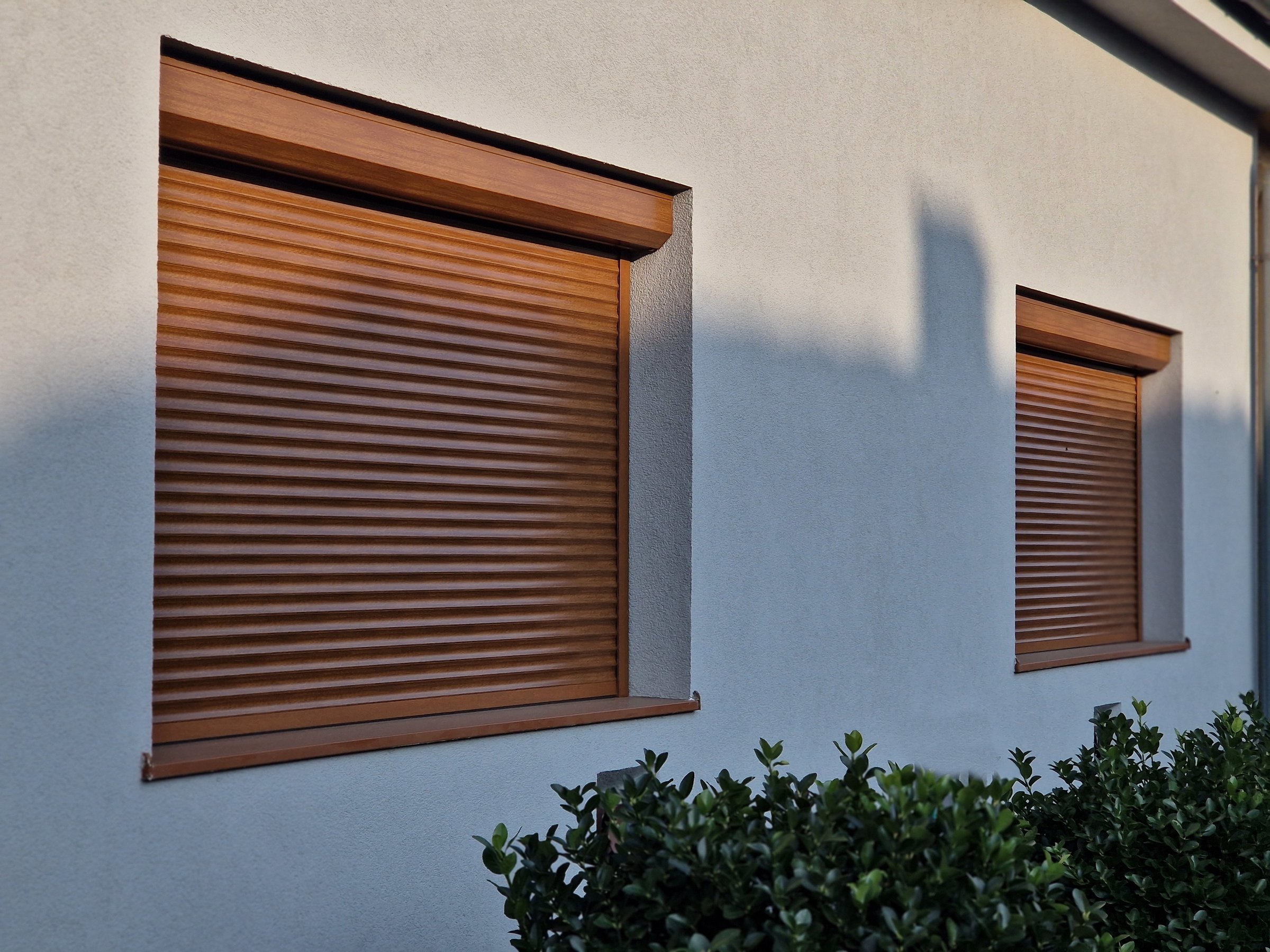 blinds on wall of glass building covers the window and shadow from the sun the interior building.grey color.metal strips connected by strips of cables automatically controlled, temperature reduction