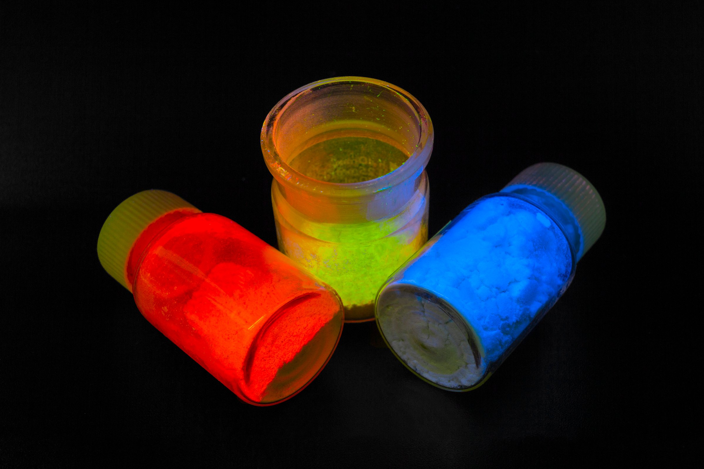 Photoluminescence chemical materials, called fluorescent. Powder glows in the dark under UV light radiation of different colors. For OLED displays manufacturing.