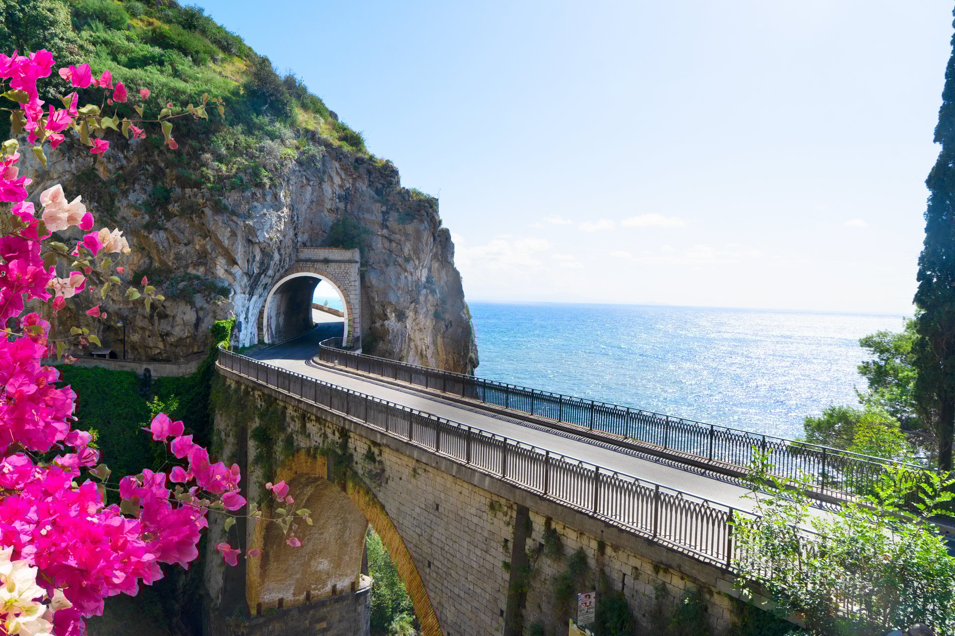 famous picturesque winding road of Amalfi coast, summer with flowers, Italy