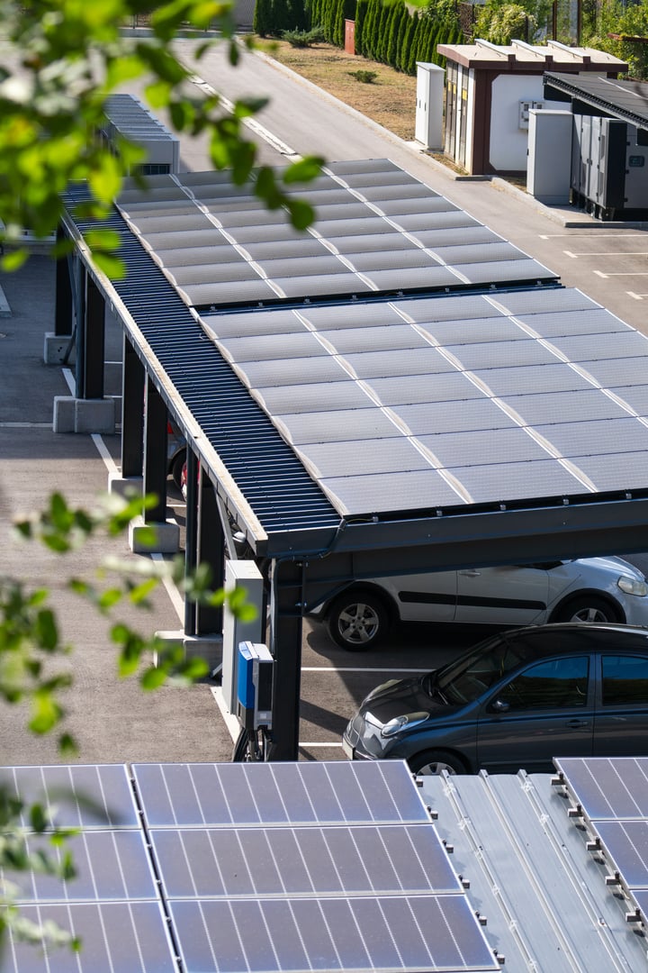 Parking space with solar panels on a roof. Solar canopy.