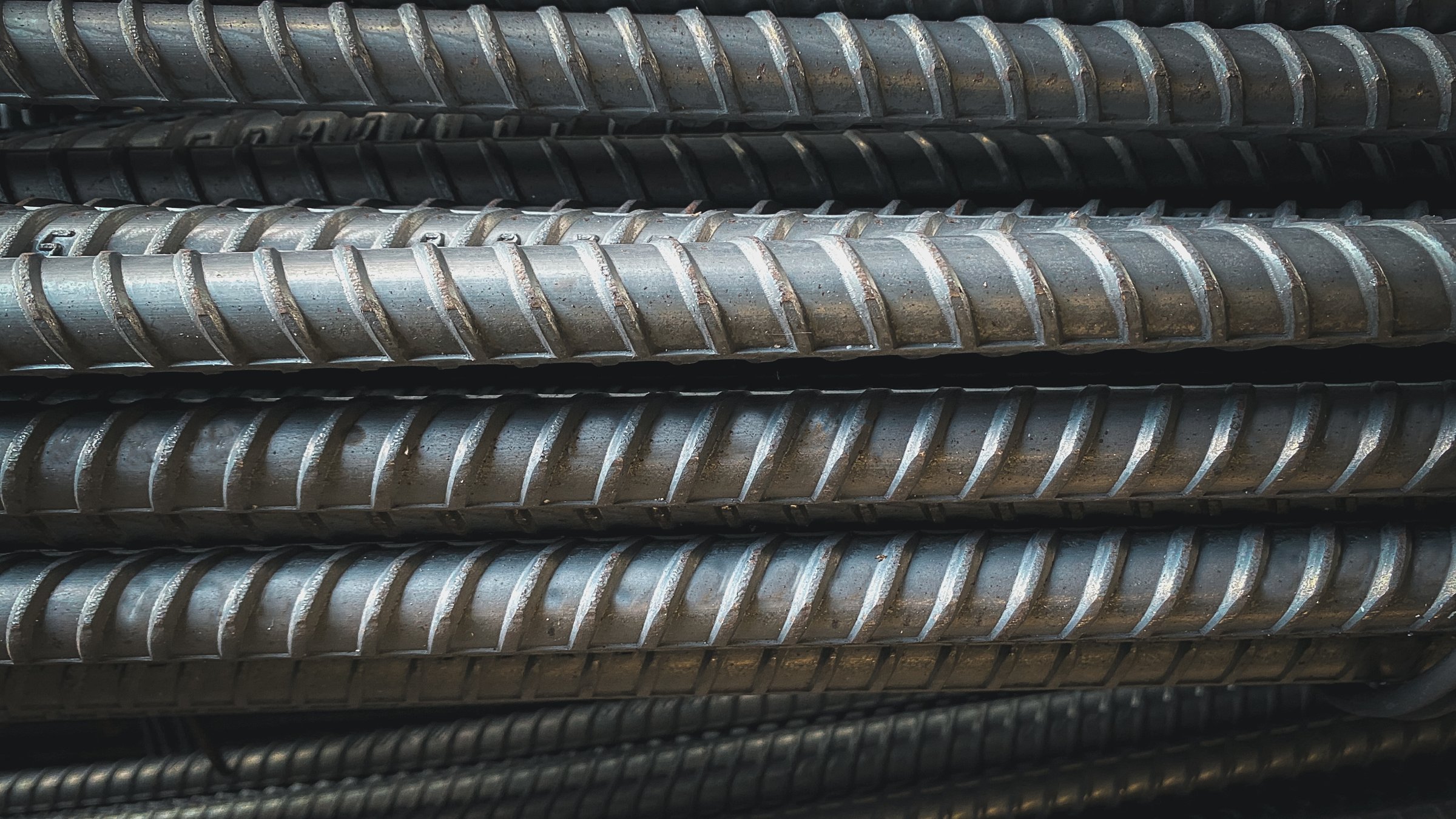 steel deformed or bars background Deformed steel bars for reinforced concrete. Close up Reinforcement steel rod and deformed bar with rebar at construction site,material Product construction Factory