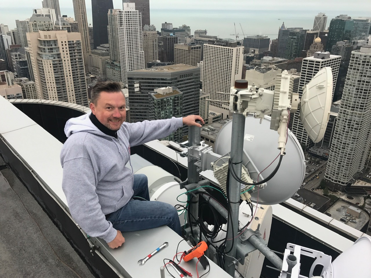 Technician installing commercial antenna