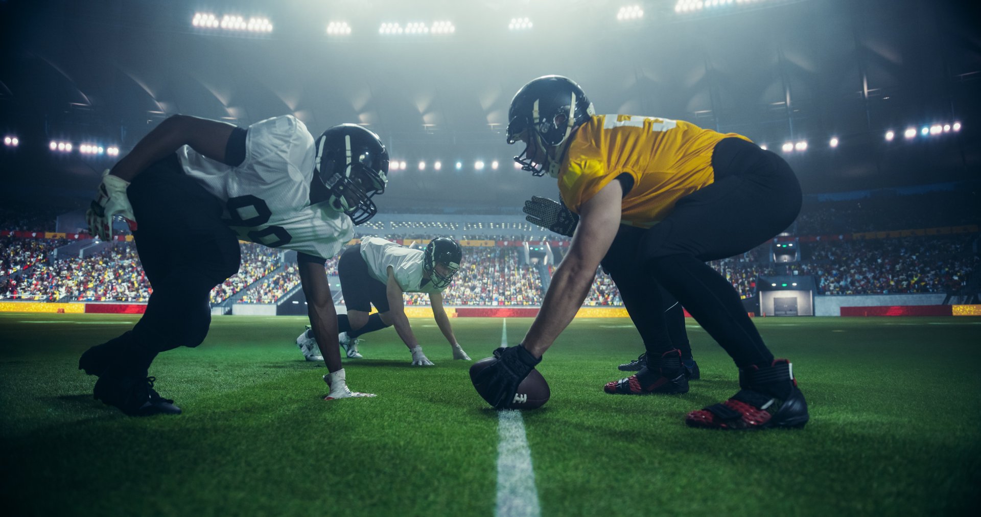 American Football Match with Players Face-off Before Action, Tackles, and Strategic Plays Start. Professional Male Footballers Fighting for the Ball, Playing a Dominant Offensive Game