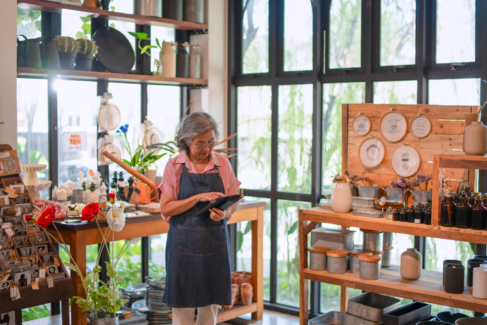 Mother, son and daughter are working at their DIY store. Small business, family business.