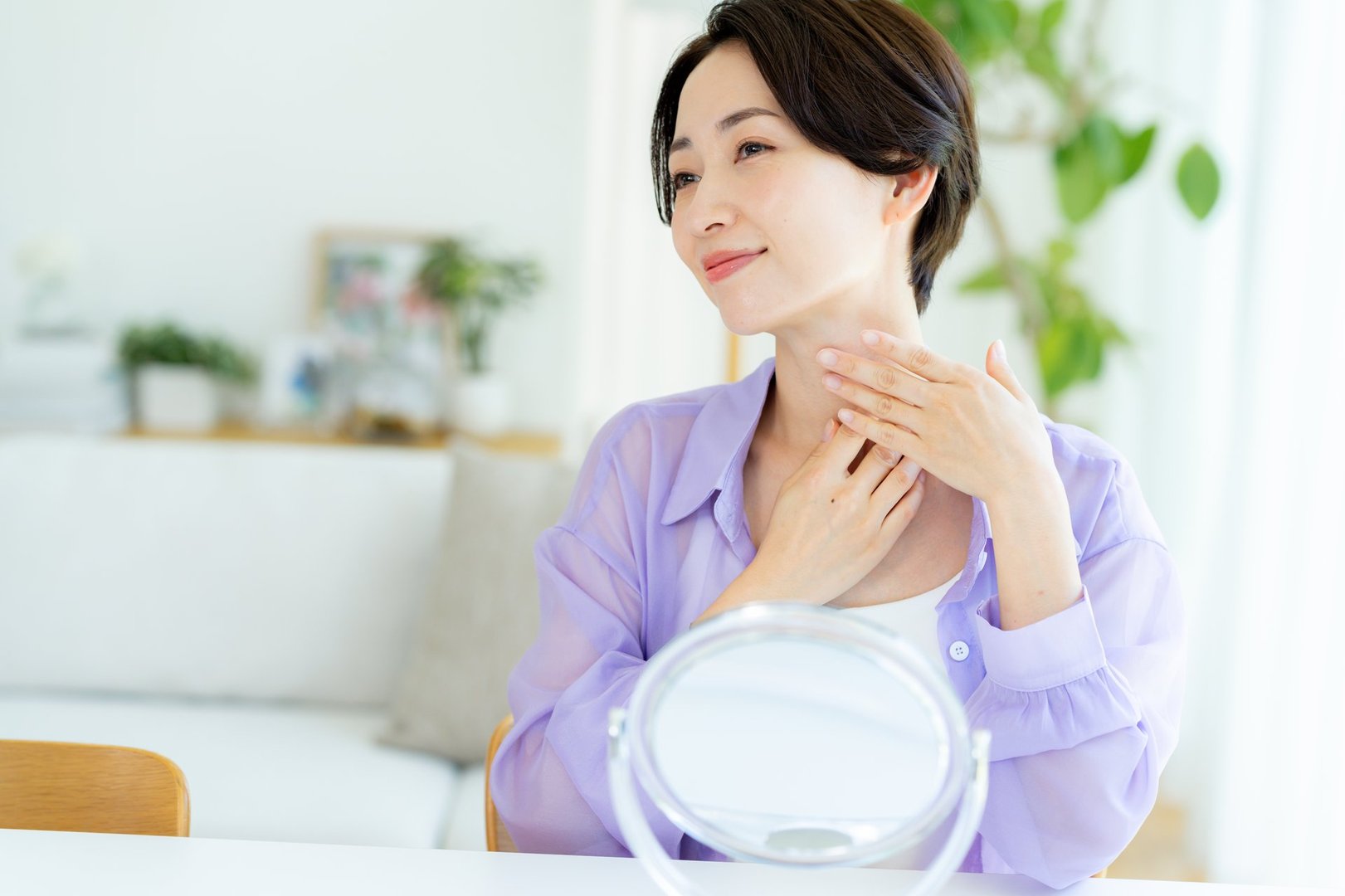 A middle-aged woman doing skin care
