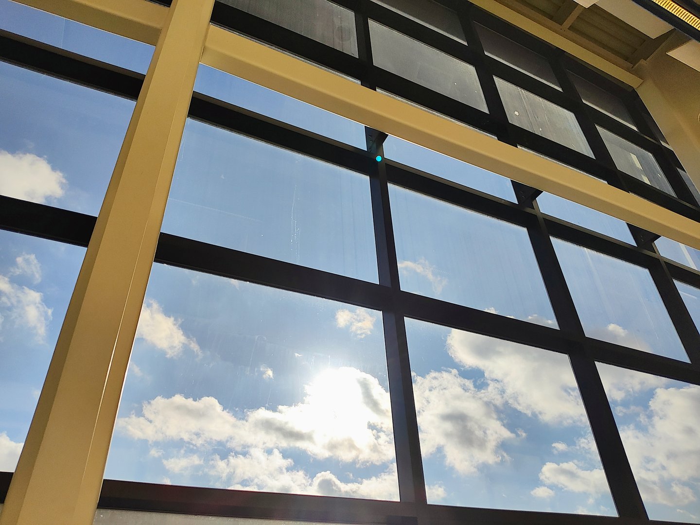 The sun and clouds from a window view