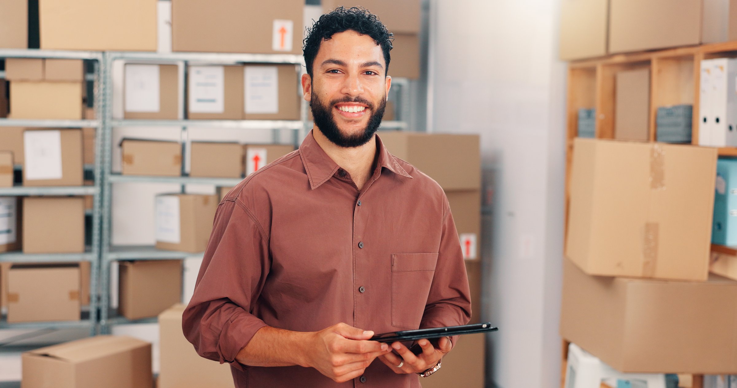 Portrait, ecommerce and happy man with tablet in small business for stock, logistics and distribution. Confidence, shipping and worker with technology in startup warehouse, supplier and procurement