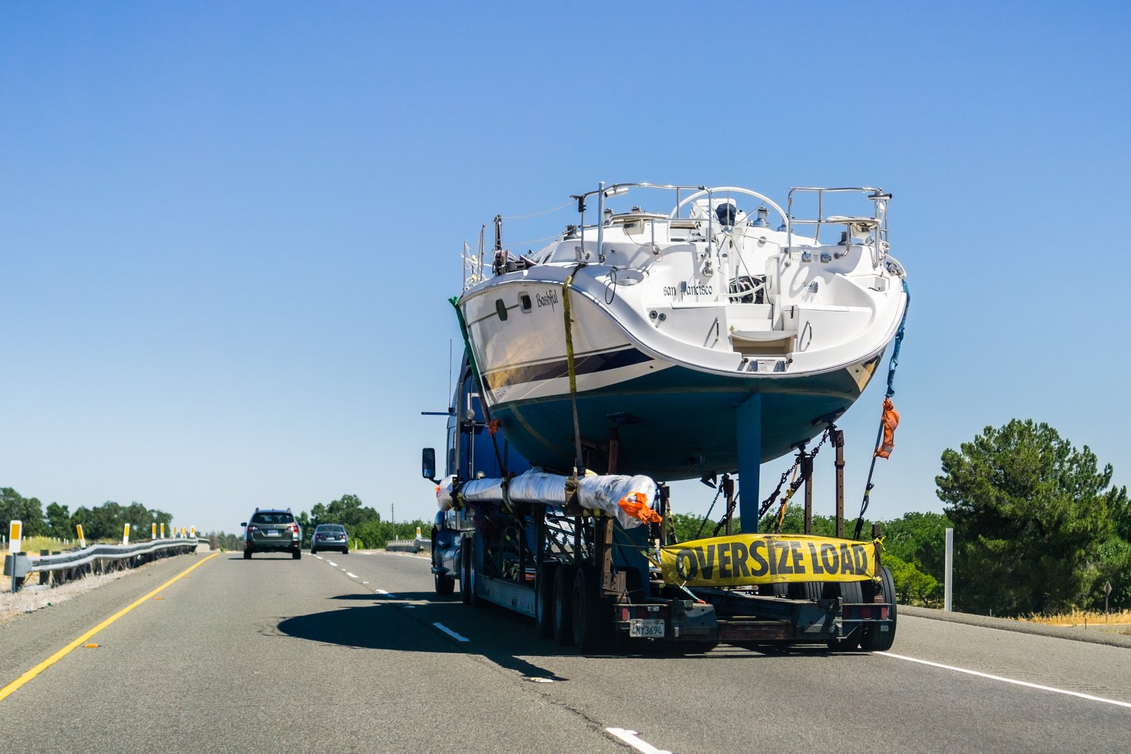 June 24, 2018 Redding / CA / USA - Truck carrying large boat on the interstate