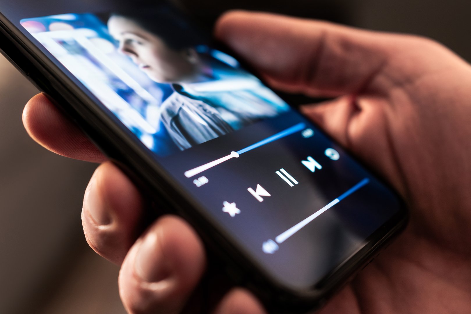 Music in phone. Stream playlist app. Song or podcast mobile player. Listen to audio record or book with smartphone. Mockup interface. Digital album cover of an artist. Online radio on cellphone screen