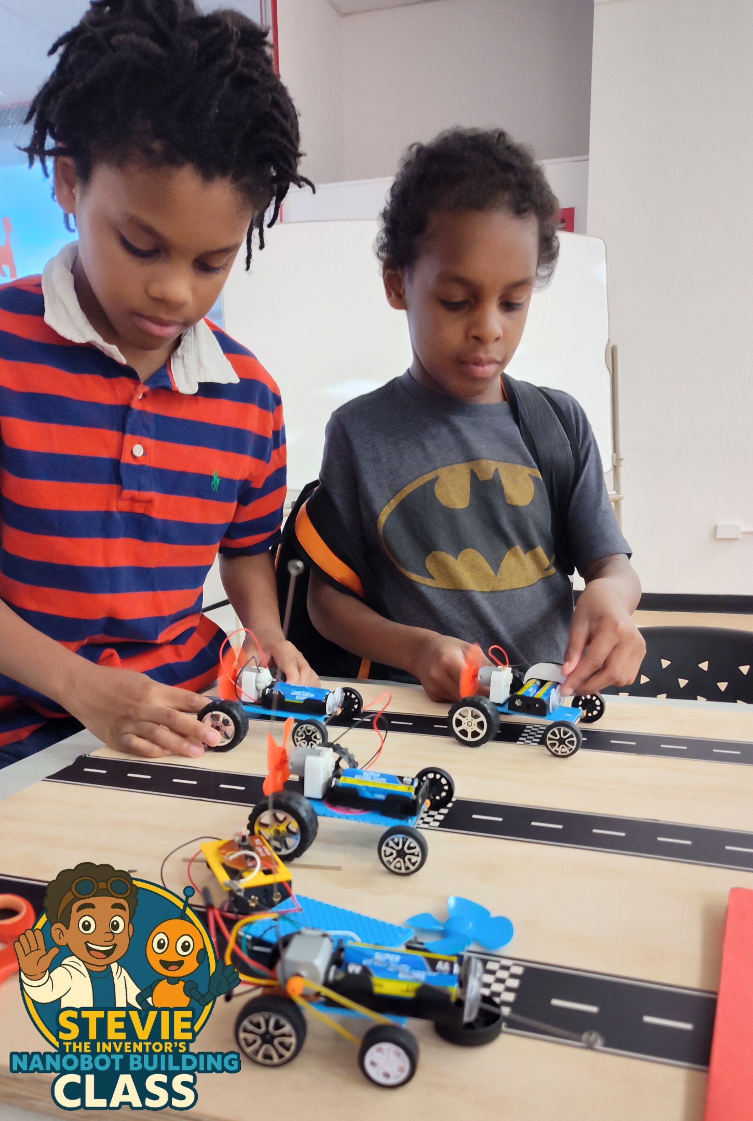 Students building robots in Stevie The Inventor's class