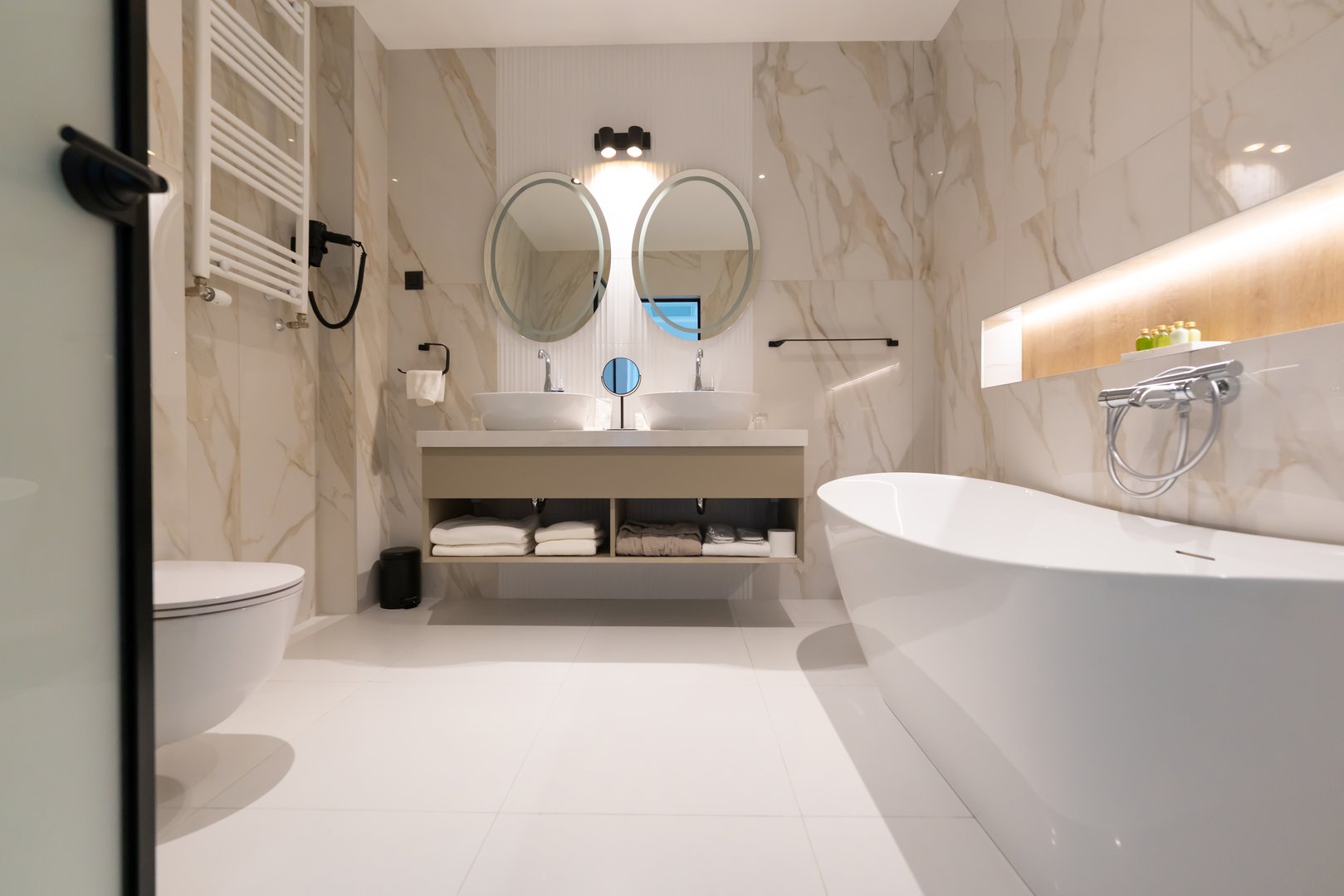 Modern hotel bathroom with freestanding tub