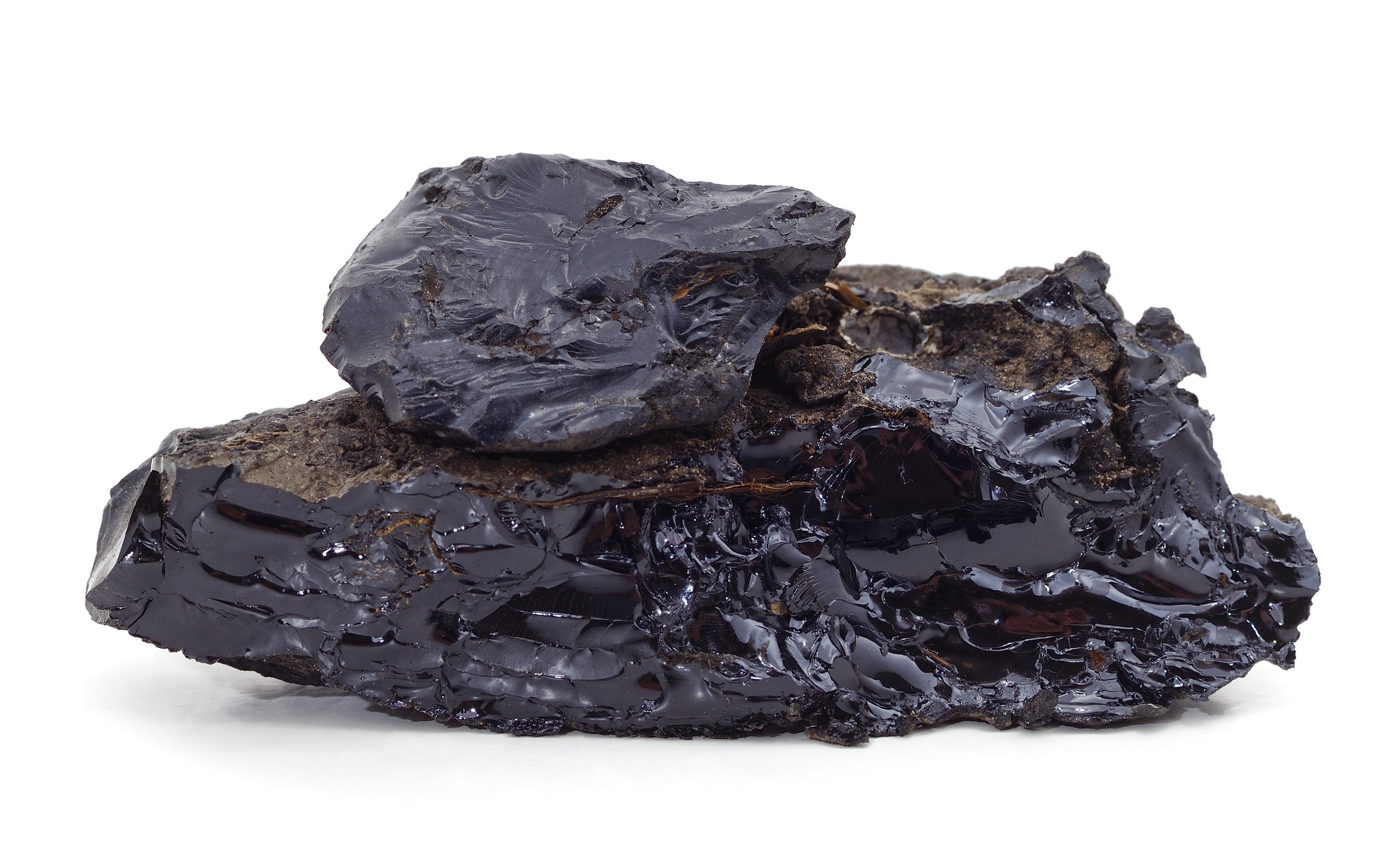 A pile of black resin isolated on a white background.