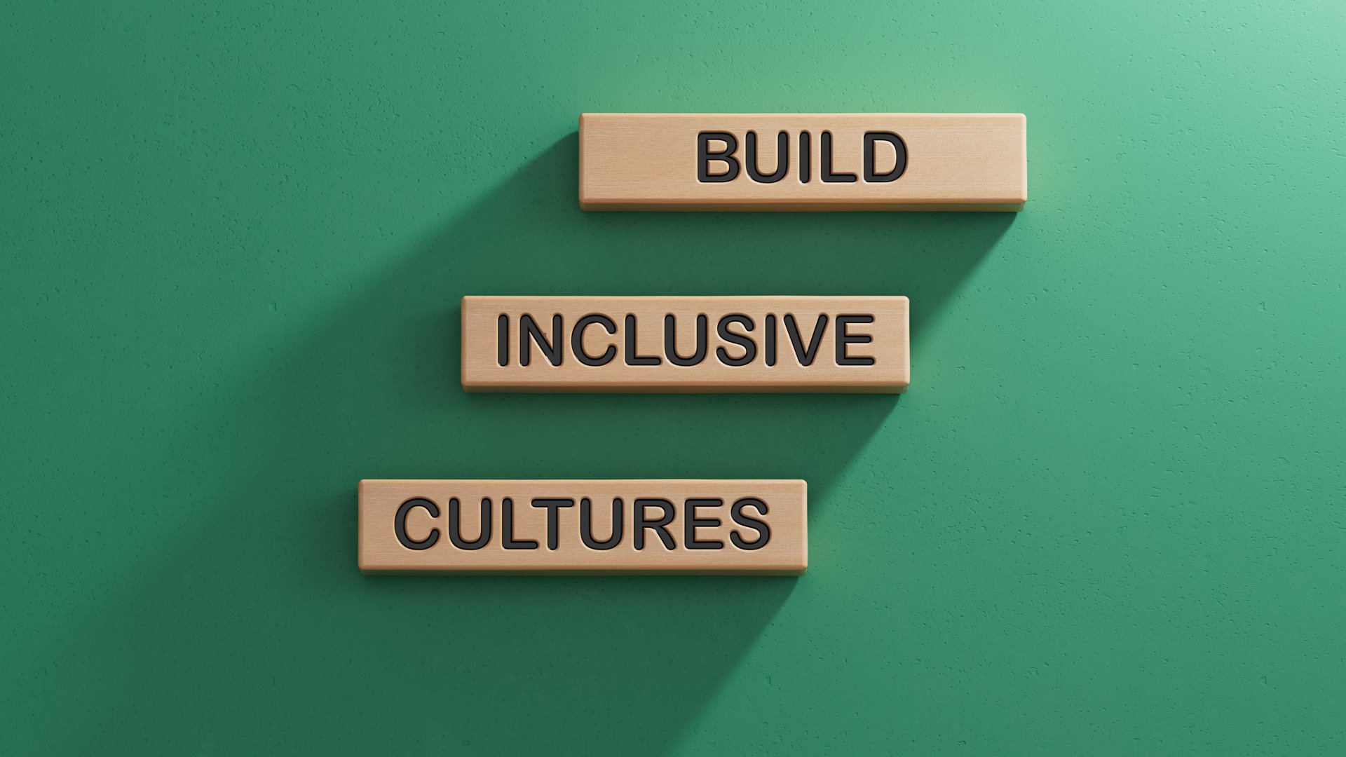 Build Inclusive Cultures symbol. Wooden blocks with words Build Inclusive Cultures.Business and Build Inclusive Cultures. Copy space.3D rendering on green background.