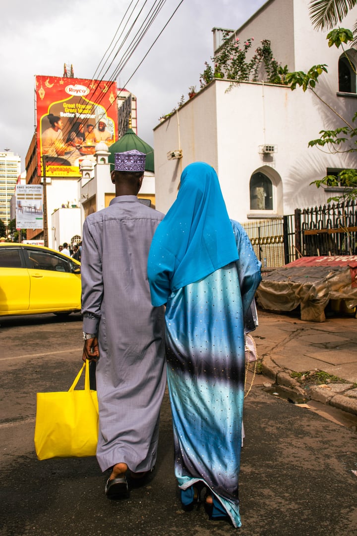 Nairobi, Kenya - 03/30/2025- A young Muslim couple walking towards the Mosque.