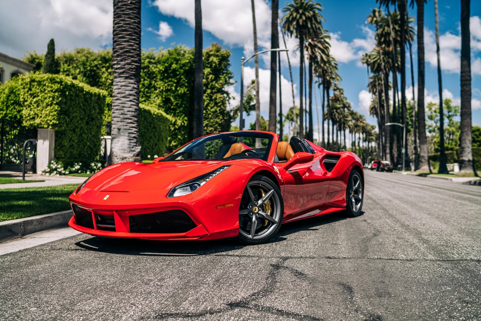 LA, CA, USAJuly 1, 2025Ferrari 488 parked showing the front of the car with palm trees in the background