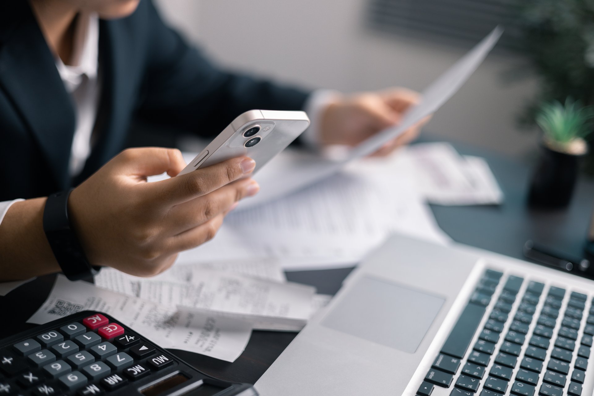 Finance bank tax expense accounting budget money businessman hand use Financial calculate accountant close up calculator with graph chart write office desk Business expense analysis saving home car