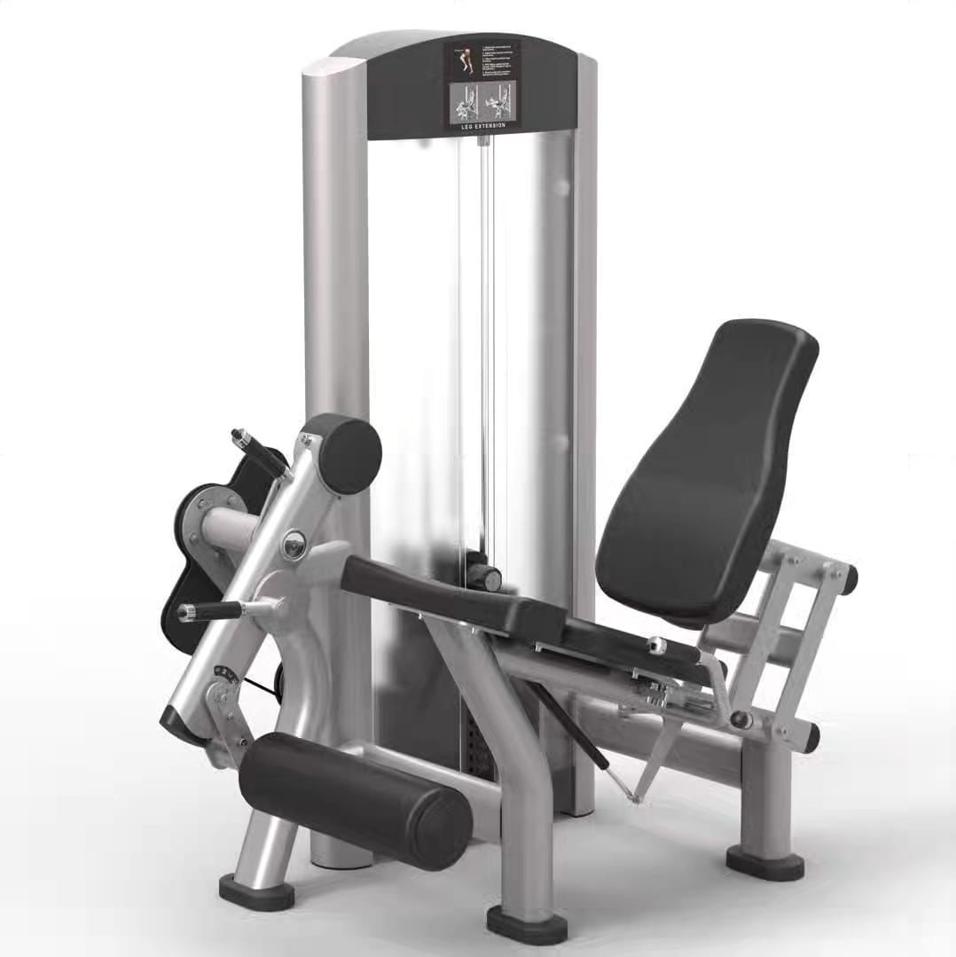 Leg curl machine with padded seat and adjustable weights, designed for hamstring exercises in a gym setting.