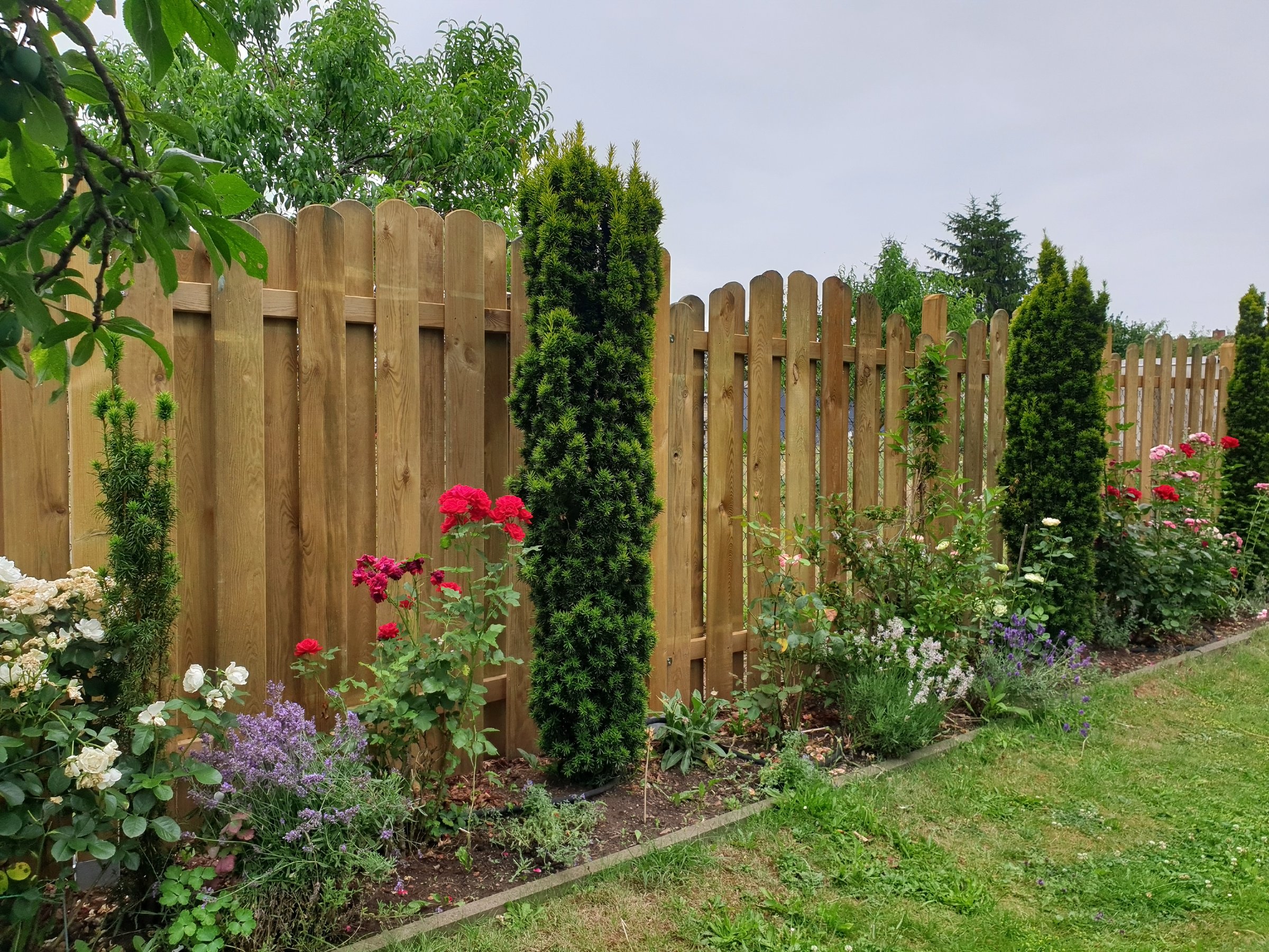 Garden fence with flower bed