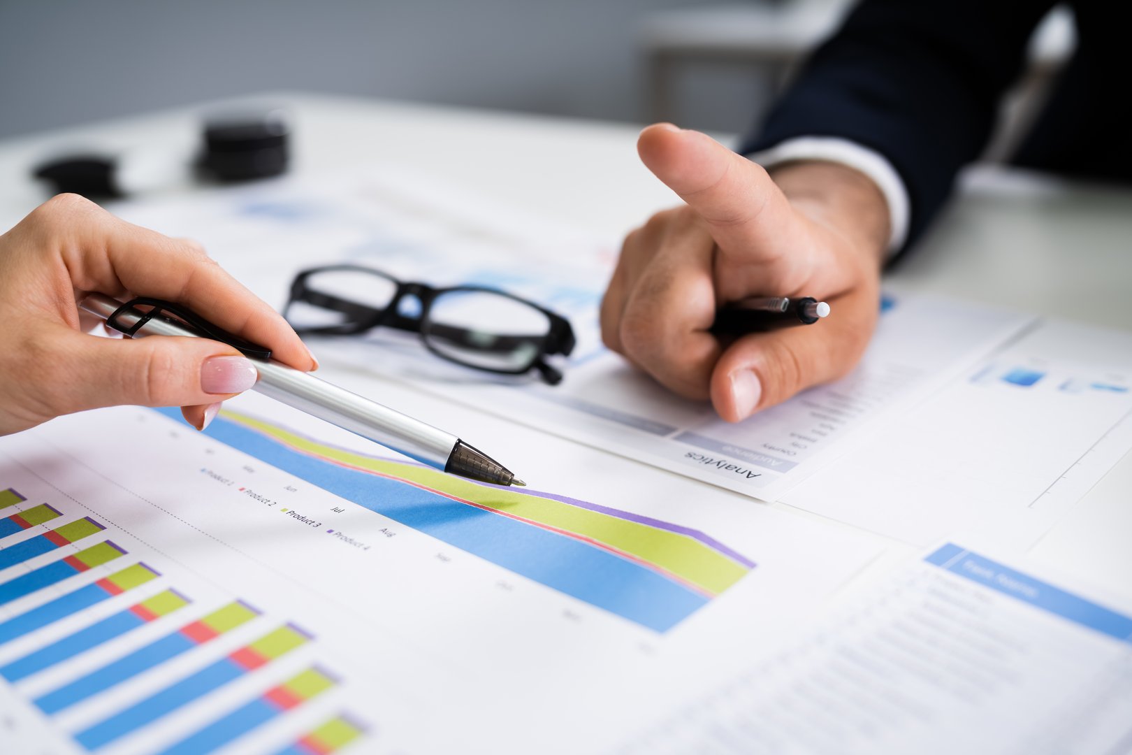 Financial Advisor Looking At Growth Progress Chart Or Graph