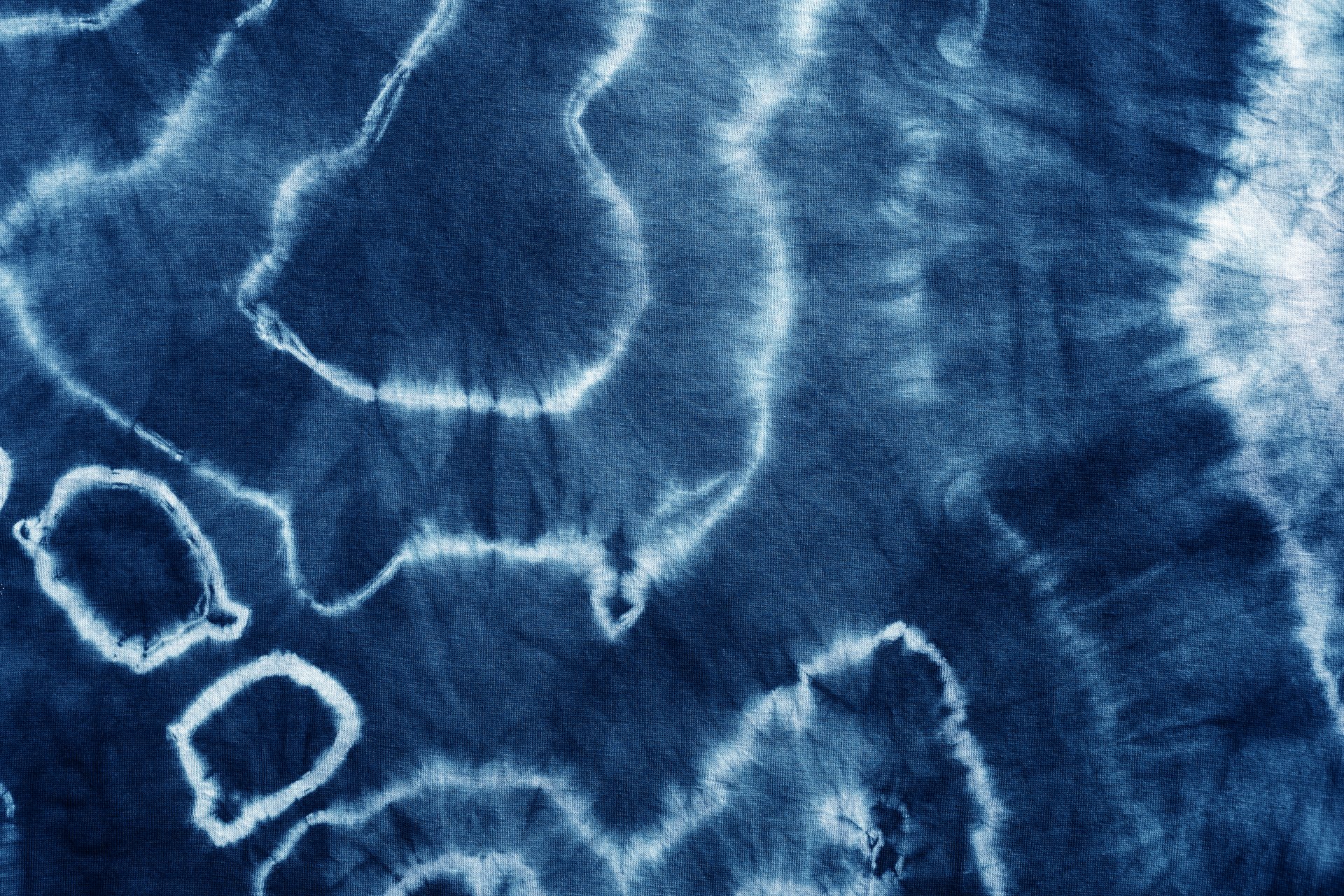 indigo tie dye pattern hand dyed on cotton fabric abstract texture background.